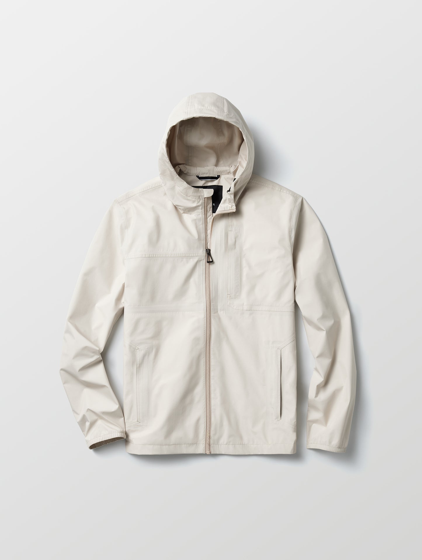 Flat lay view of Storm All-Weather Jacket in Bone white from AETHER Apparel.