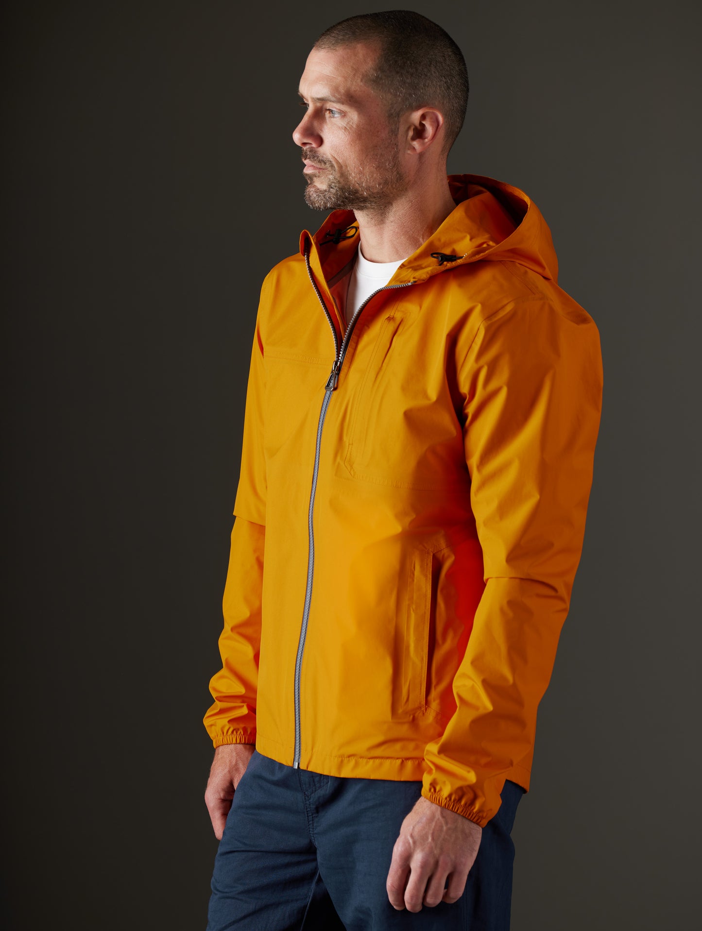 man wearing orange jacket from AETHER Apparel