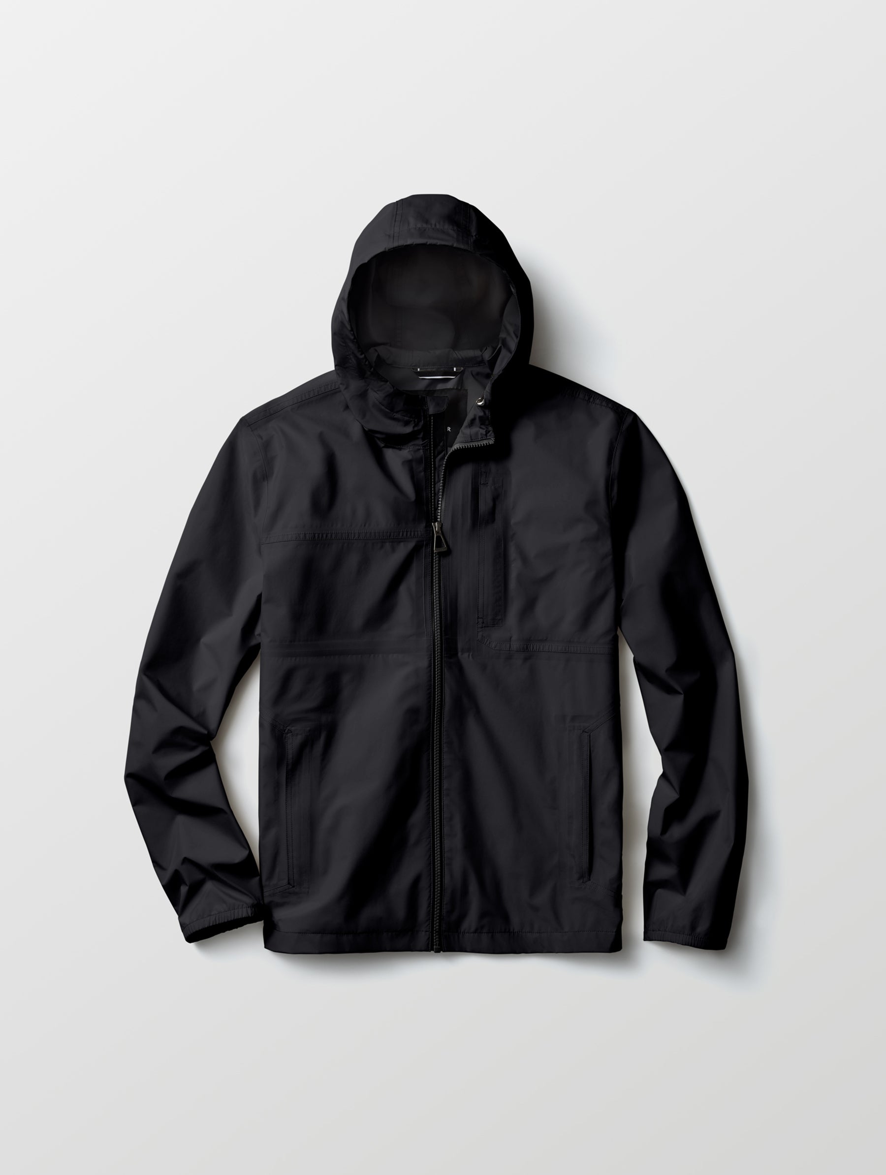Flat lay view of Storm All-Weather Jacket in Onyx Black from AETHER Apparel.