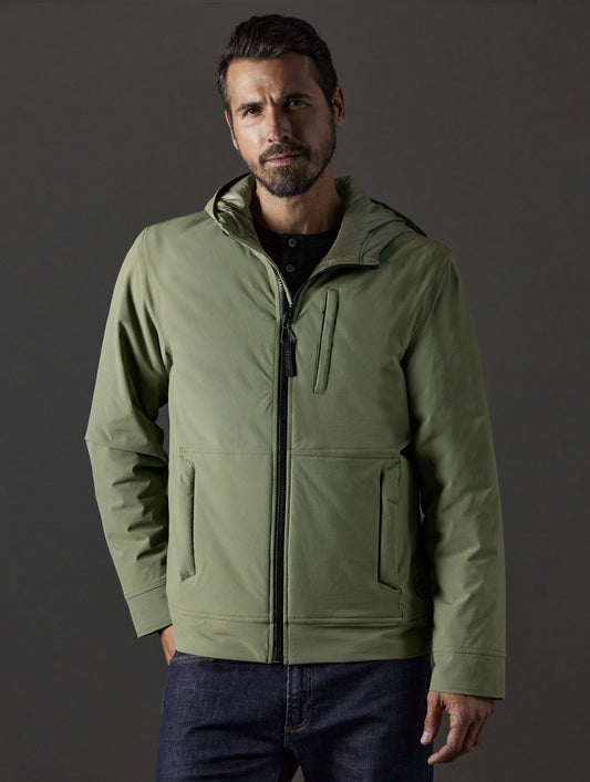 Front body view of man wearing Stornaway Insulated Hoodie in Fern Green from AETHER Apparel.