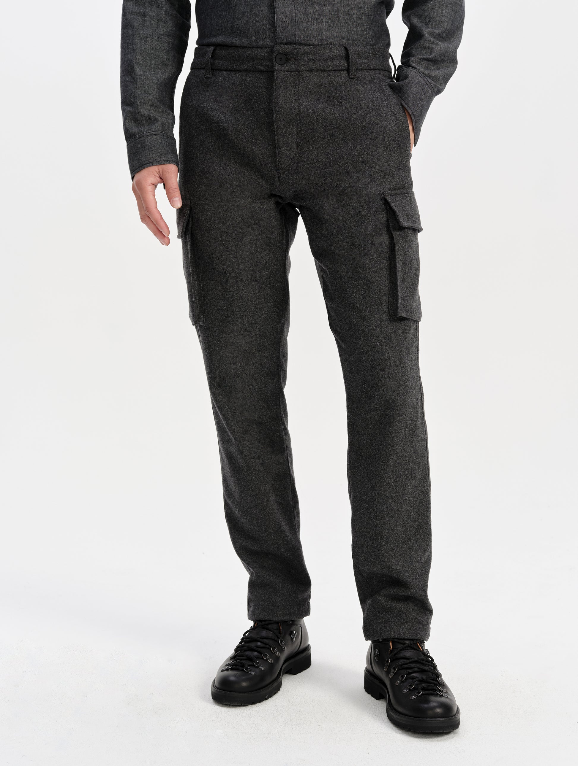 Front lower-body view of man wearing the Strata Wool Pant in Charcoal Heather from AETHER Apparel.