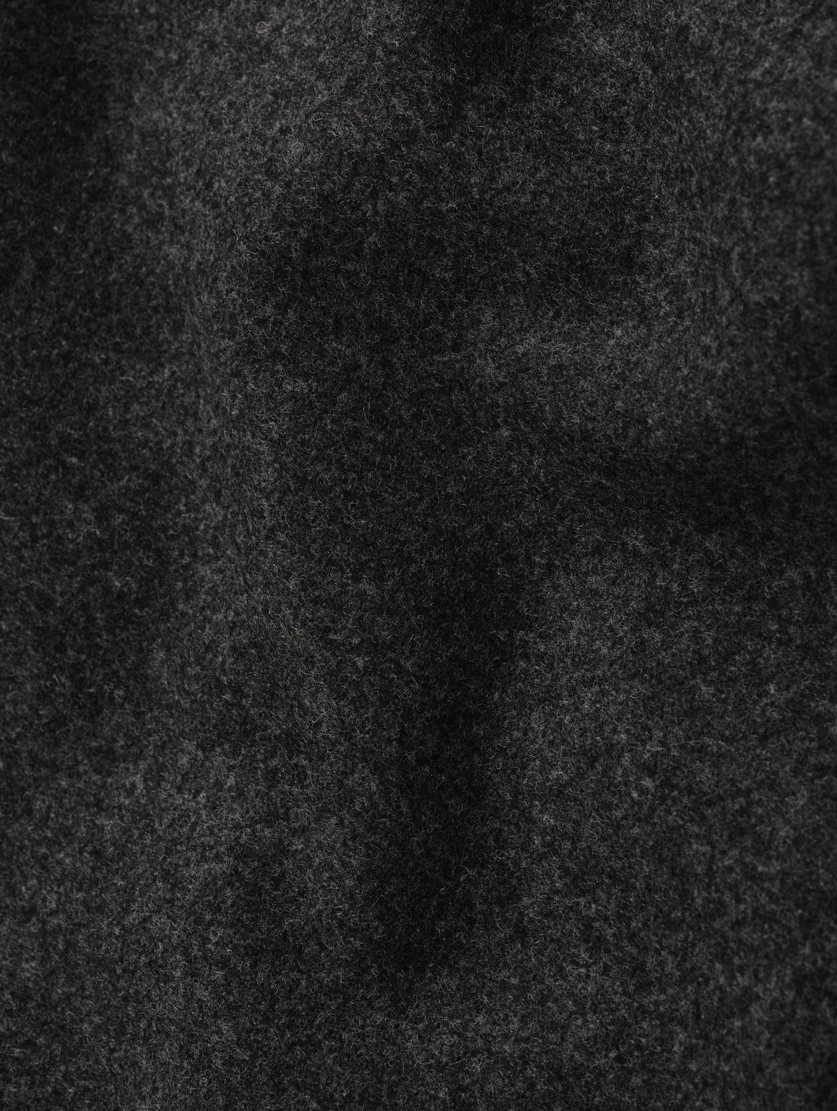 Closeup detailed view of the wool blend construction on the Strata Wool Pant in Charcoal Heather from AETHER Apparel.