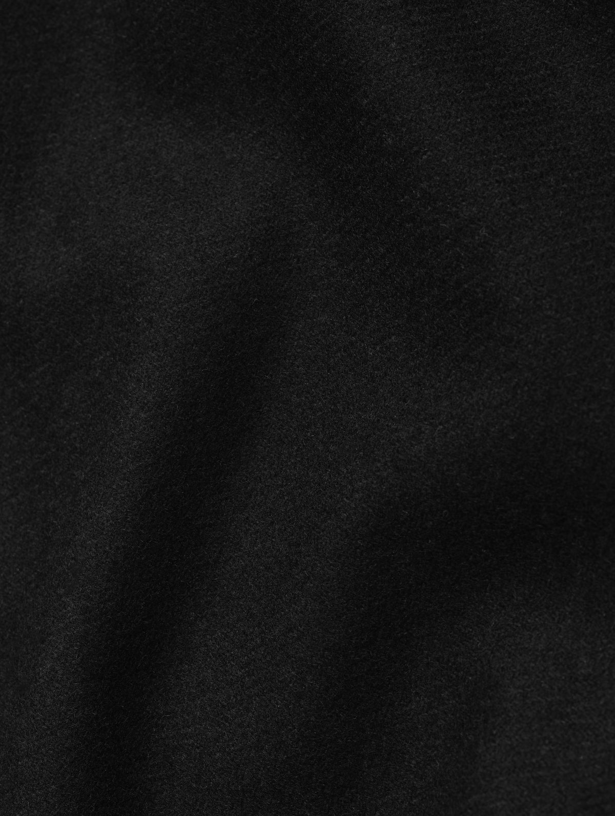 Closeup detailed view of the wool blend construction on the Strata Wool Pant in Onyx Black from AETHER Apparel.