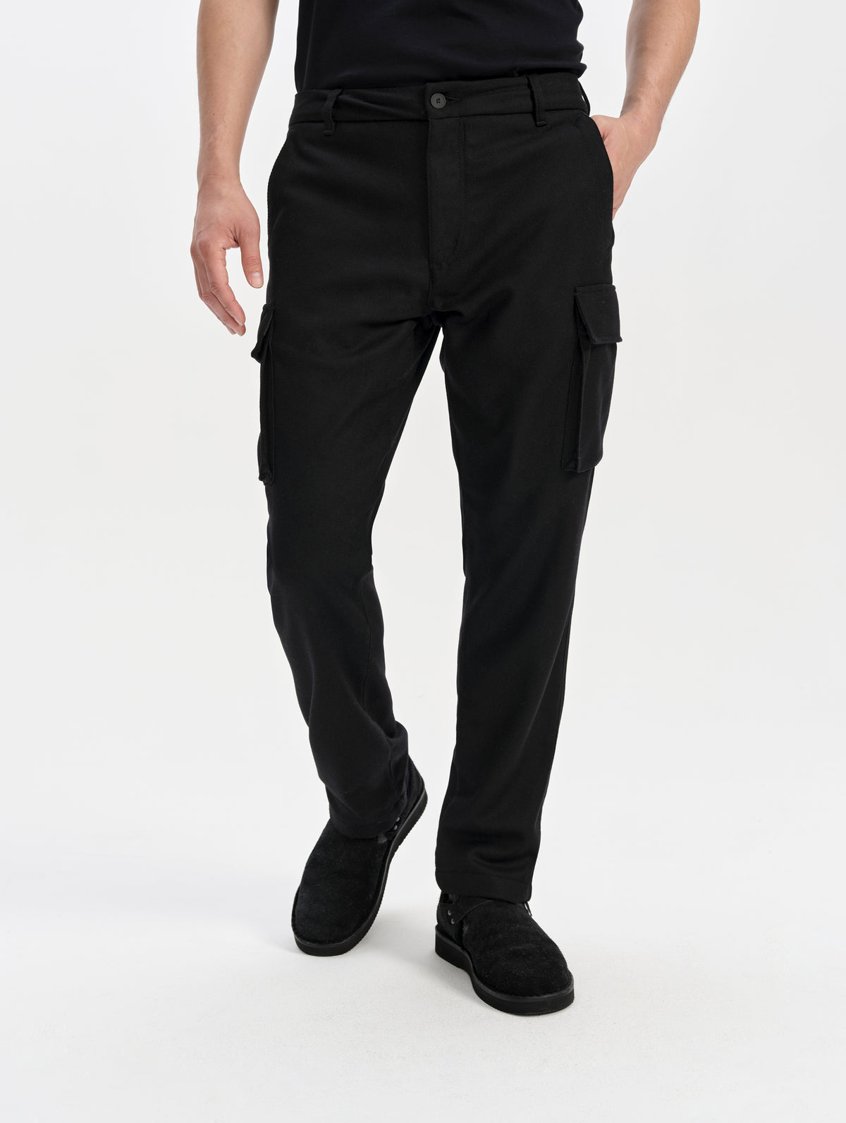 Front lower-body view of man wearing the Strata Wool Pant in Onyx Black from AETHER Apparel.