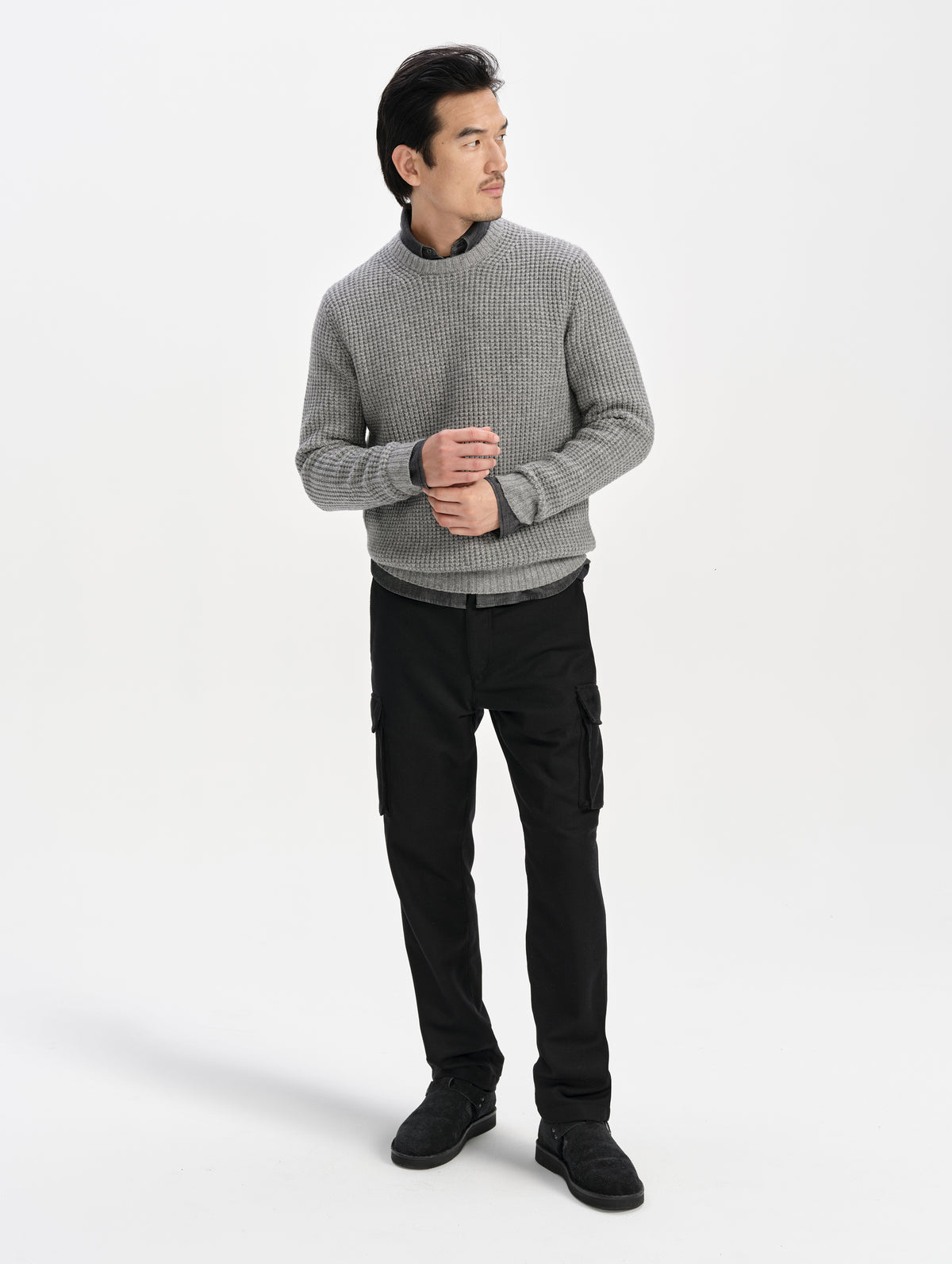 Front full-body view of man wearing the Strata Wool Pant in Onyx Black from AETHER Apparel.