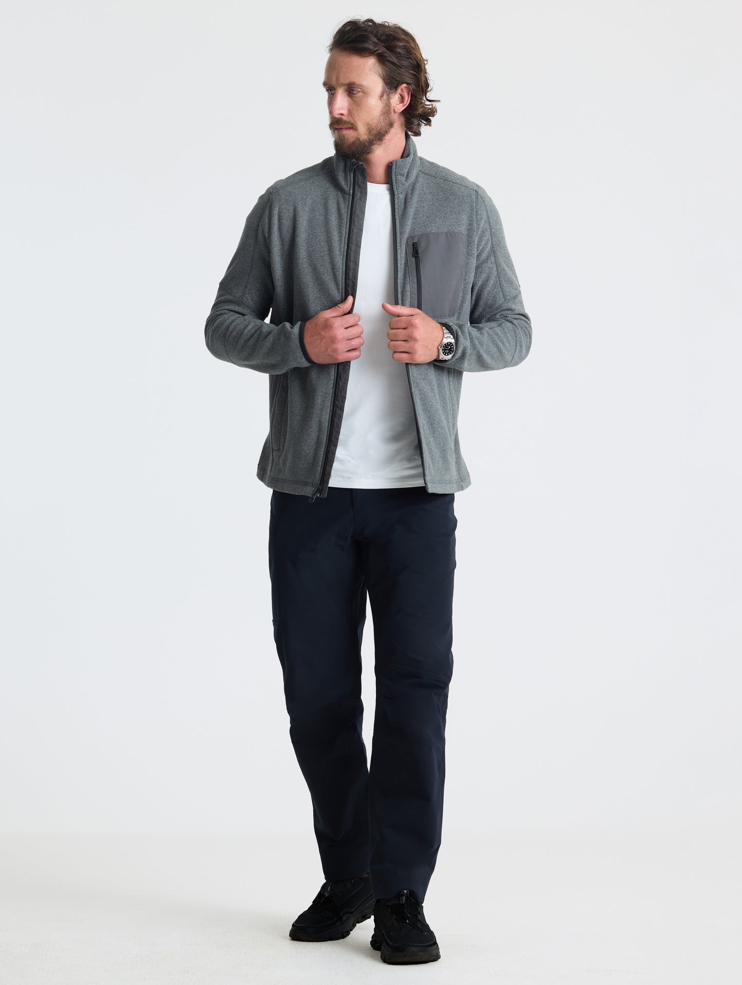 Full body view of man wearing Sutherlin Full-Zip in Charcoal Grey from AETHER Apparel.