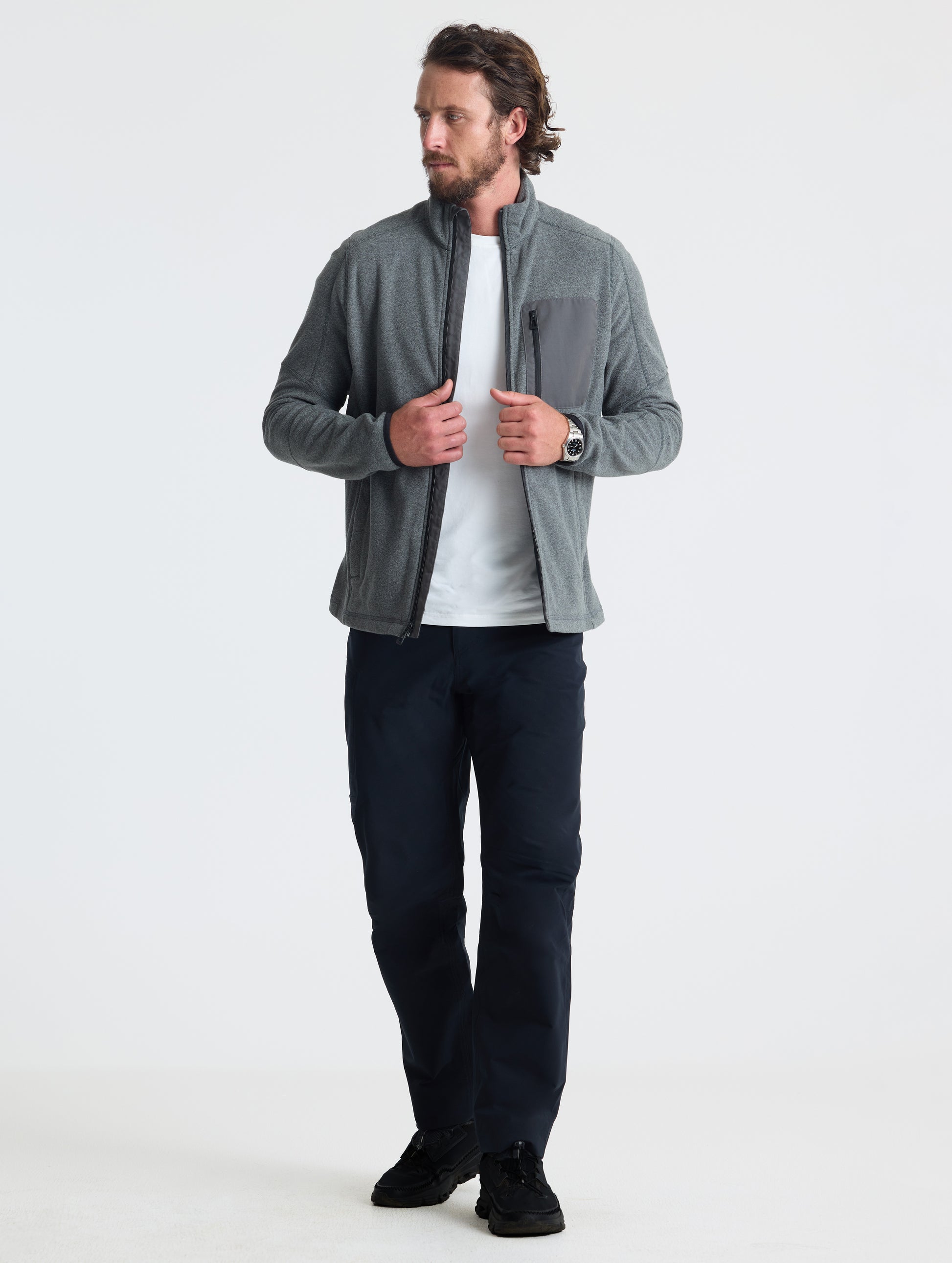 Full body view of man wearing Sutherlin Full-Zip in Charcoal Grey from AETHER Apparel.