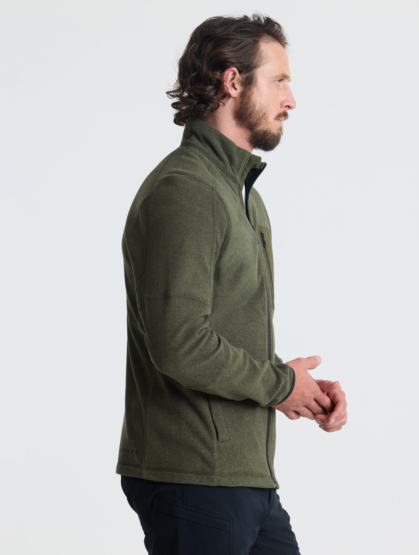 Right profile view of man wearing Sutherlin Full-Zip in Forest Green from AETHER Apparel.
