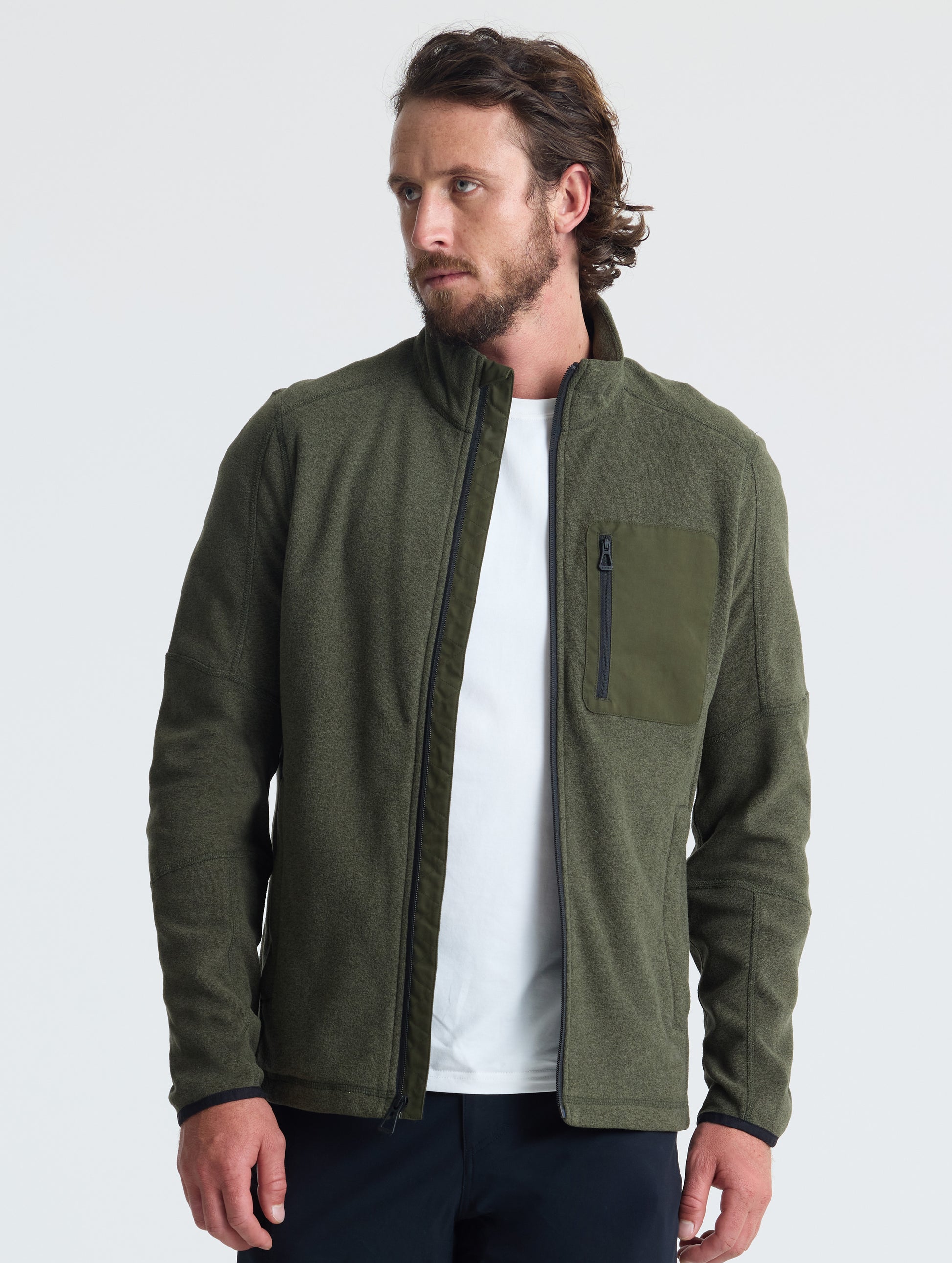 Front view of man wearing unzipped Sutherlin Full-Zip in Forest Green from AETHER Apparel.