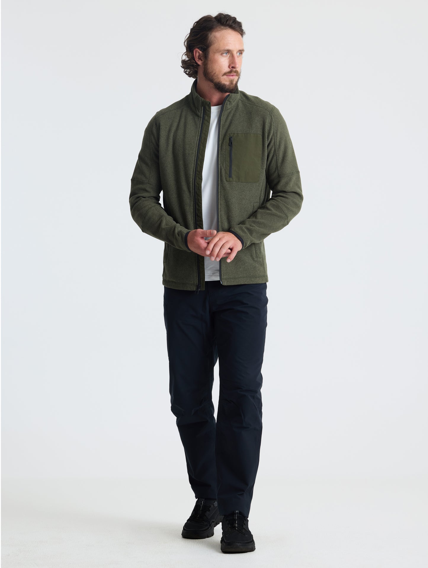 Full body view of man wearing Sutherlin Full-Zip in Forest Green from AETHER Apparel.