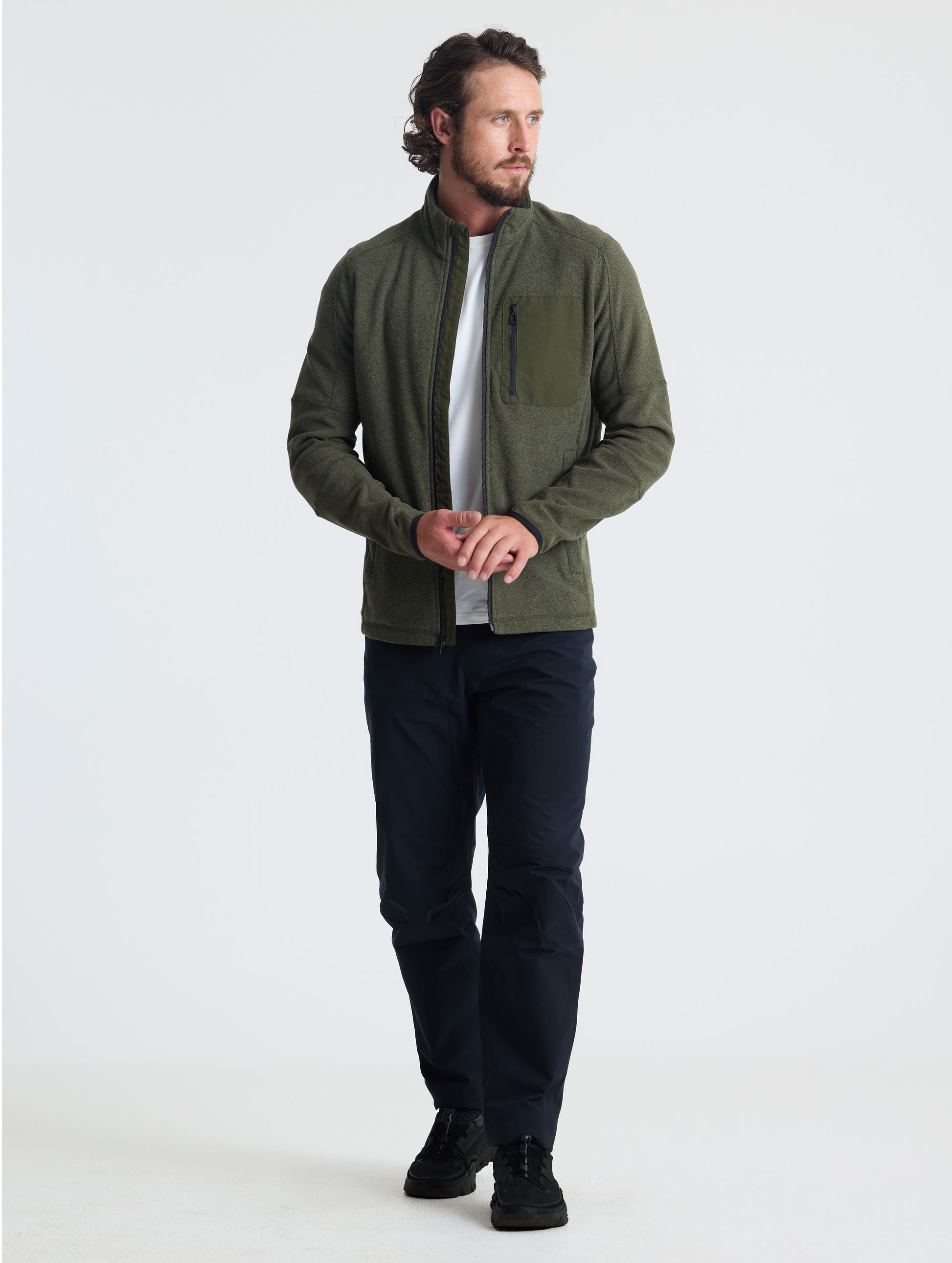 Full body view of man wearing Sutherlin Full-Zip in Forest Green from AETHER Apparel.