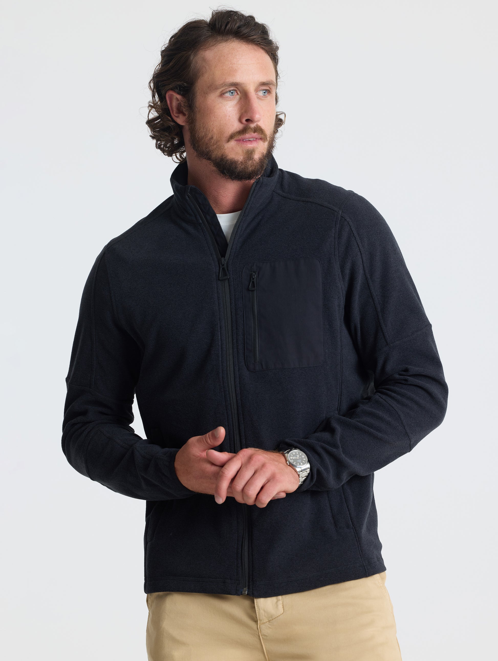 Front view of man wearing Sutherlin Full-Zip in Onyx Black from AETHER Apparel.