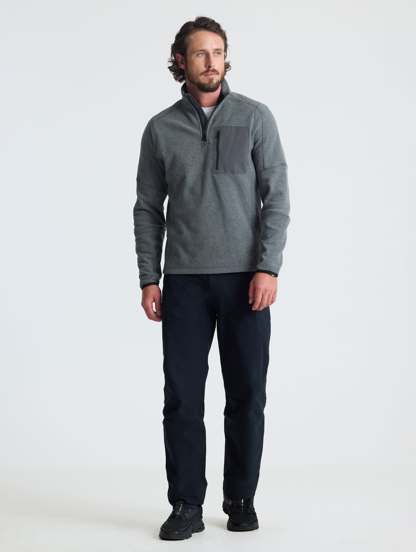 Full body view of man wearing Sutherlin Half-Zip in Charcoal Heather from AETHER Apparel.