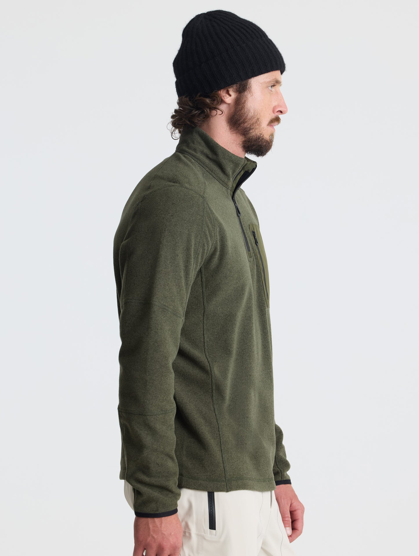 Right profile of man wearing Sutherlin Half-Zip in Forest Green from AETHER Apparel.