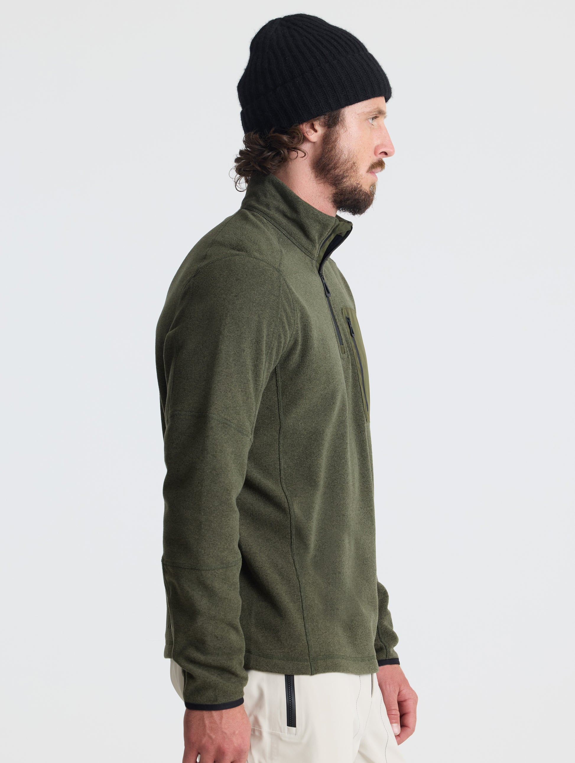 Right profile of man wearing Sutherlin Half-Zip in Forest Green from AETHER Apparel.