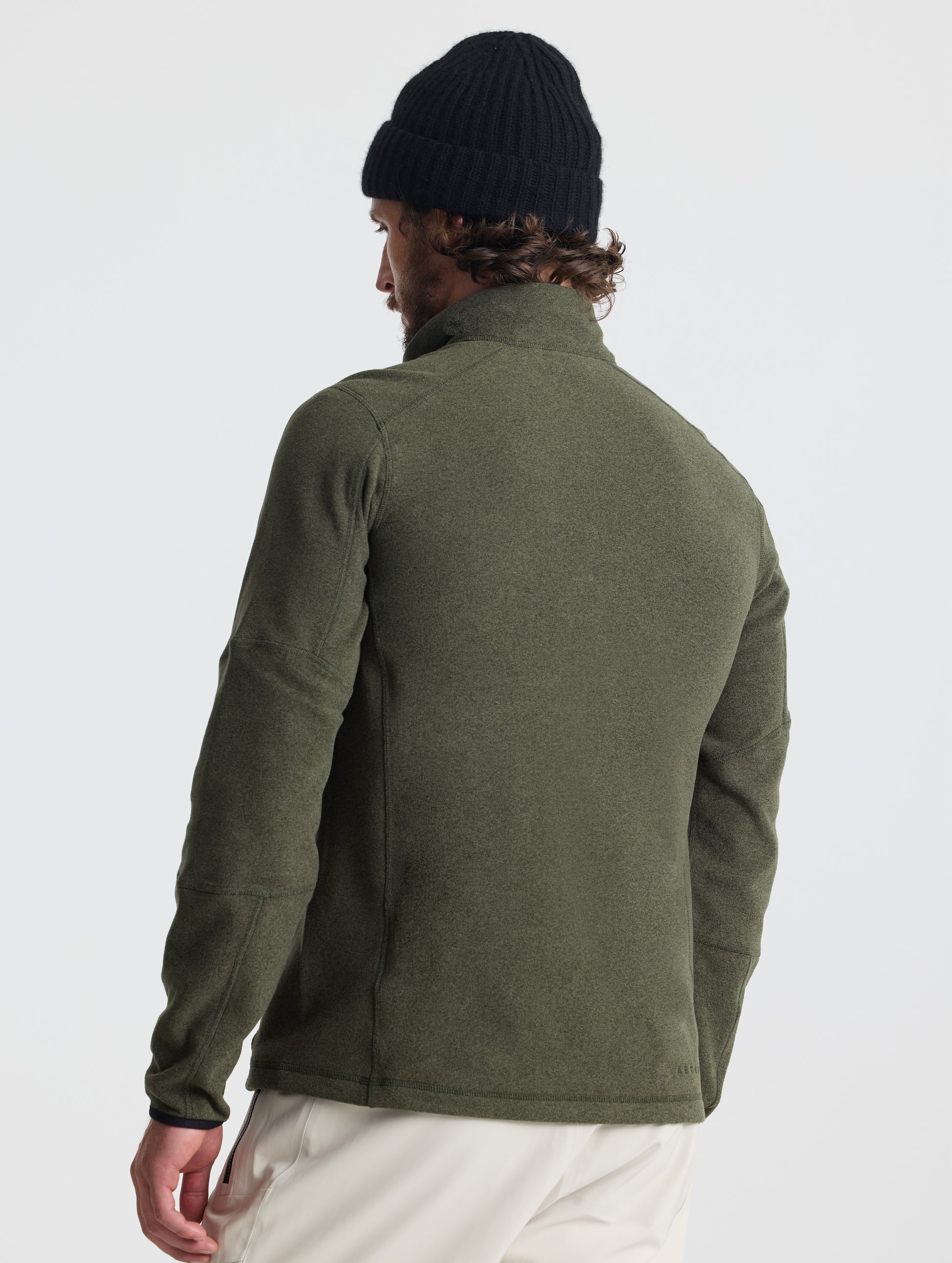 Rear view of man wearing Sutherlin Half-Zip in Forest Green from AETHER Apparel.