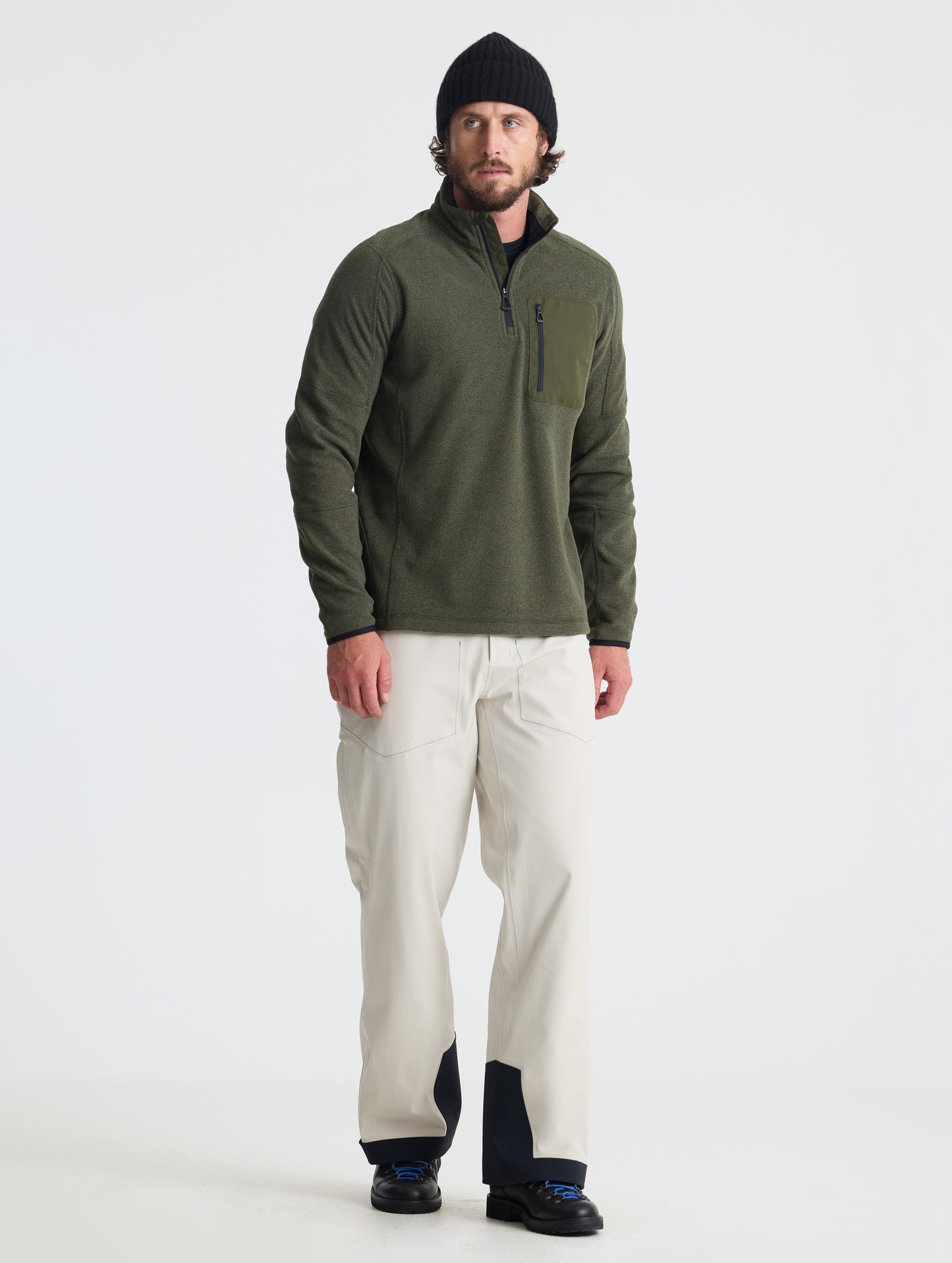 Full body view of man wearing Sutherlin Half-Zip in Forest Green from AETHER Apparel.