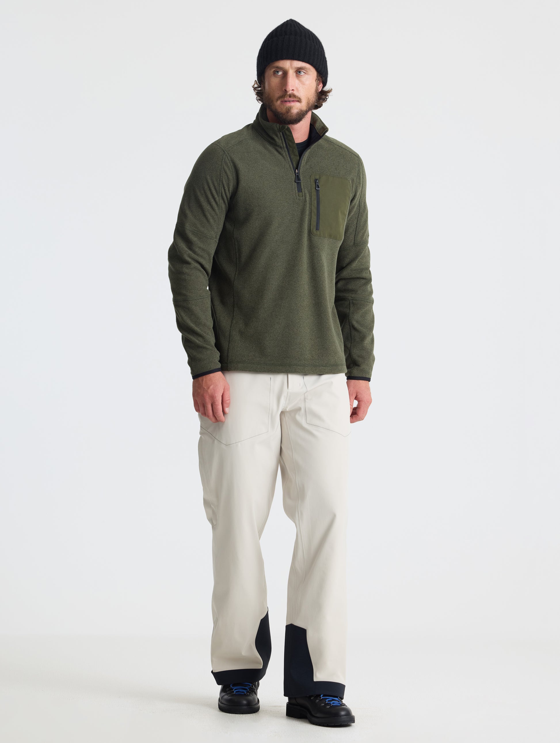 Full body view of man wearing Sutherlin Half-Zip in Forest Green from AETHER Apparel.