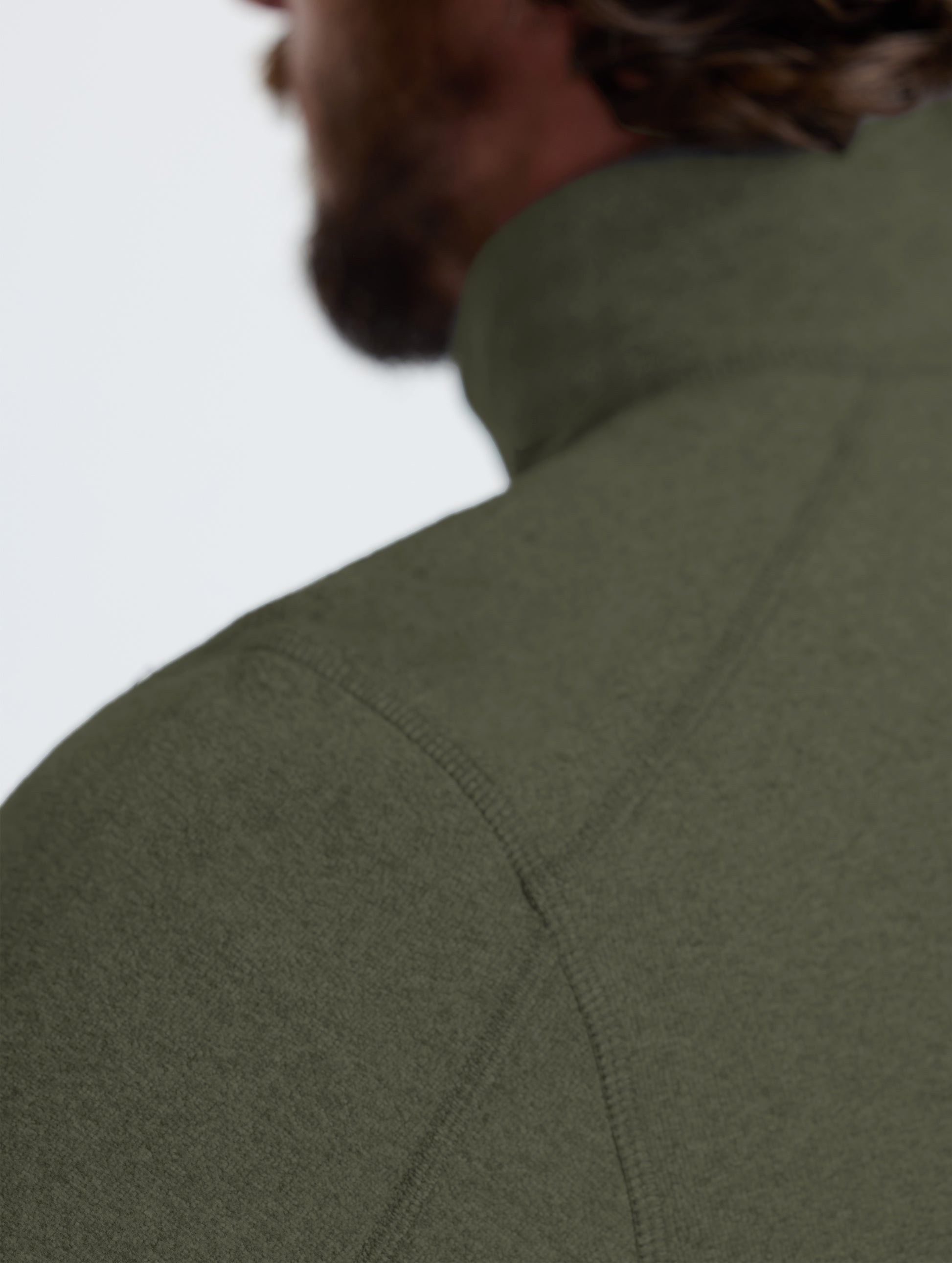 Closeup rear view of left shoulder of Sutherlin Half-Zip in Forest Green from AETHER Apparel.