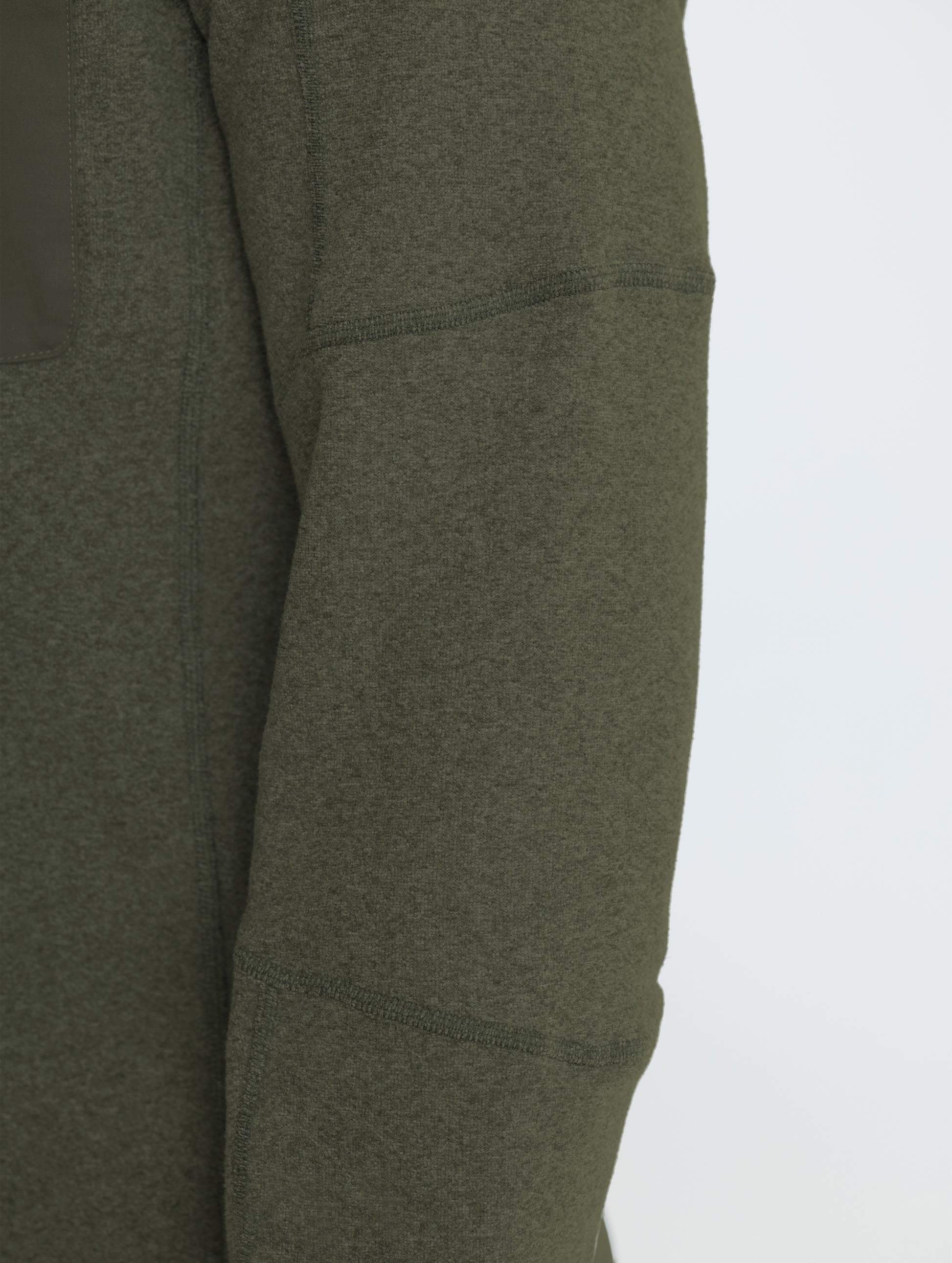 Closeup rear view of right shoulder of Sutherlin Half-Zip in Forest Green from AETHER Apparel.