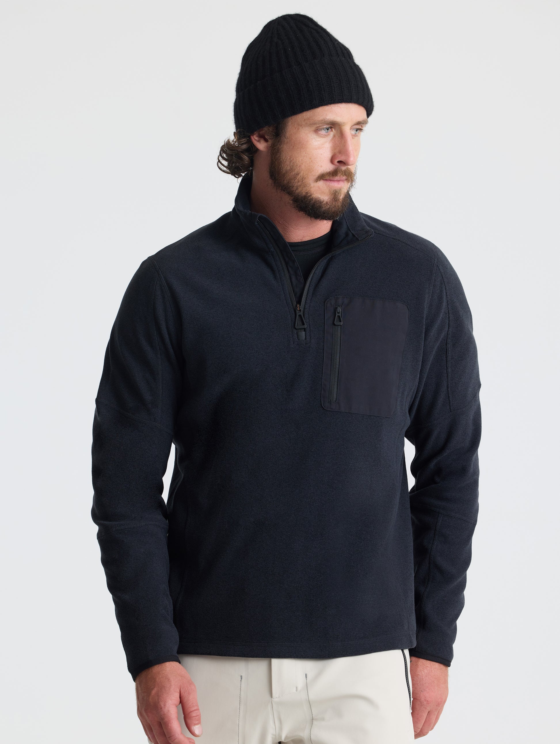 Front view of man wearing Sutherlin Half-Zip in Onyx Black from AETHER Apparel.
