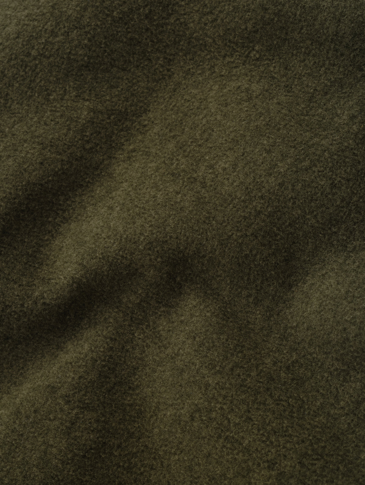 Closeup detailed view of the micro fleece construction on the Sutherlin Pant in Forest Green from AETHER Apparel.