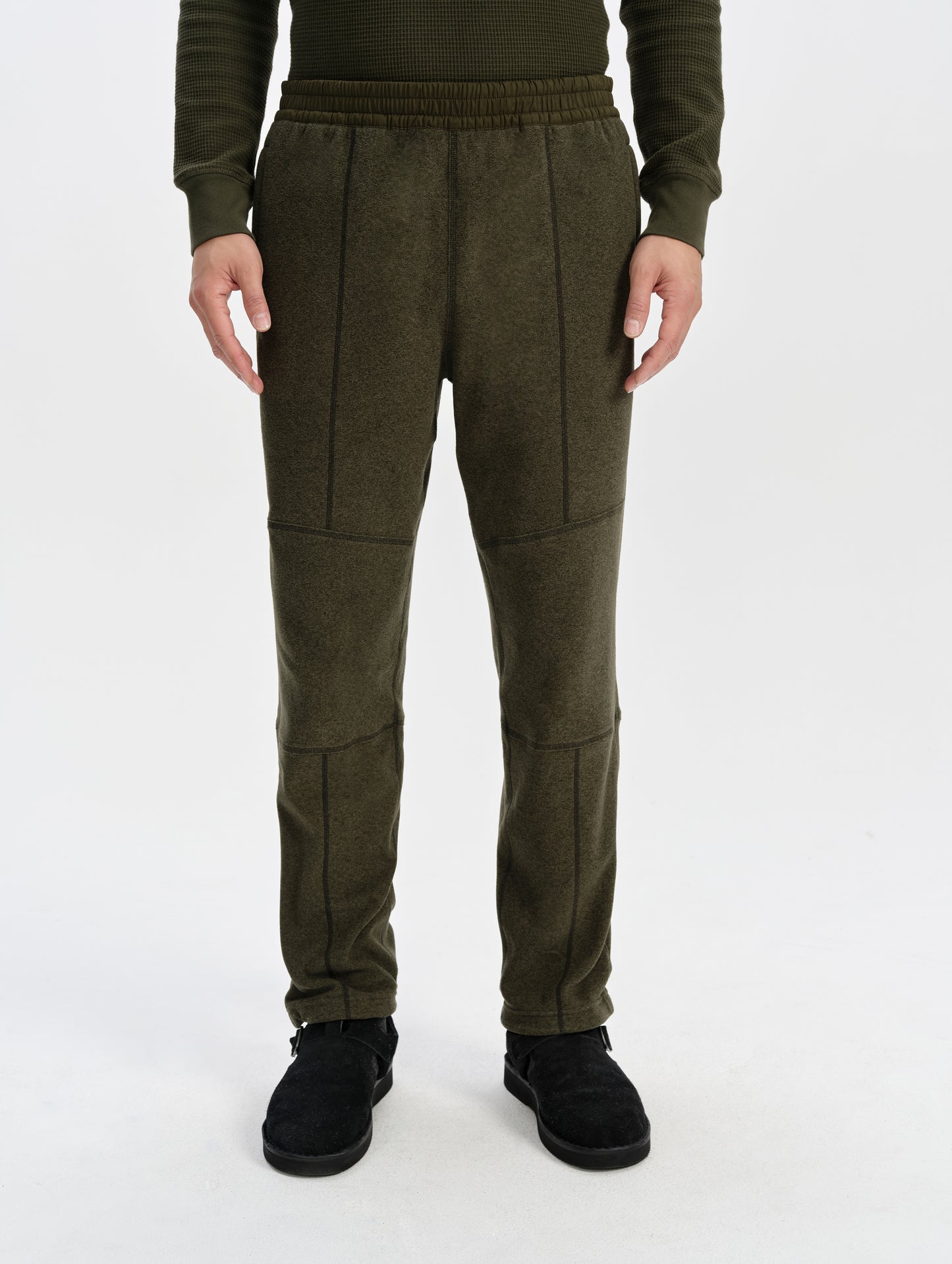 Front lower-body view of man wearing the Sutherlin Pant in Forest Green from AETHER Apparel.