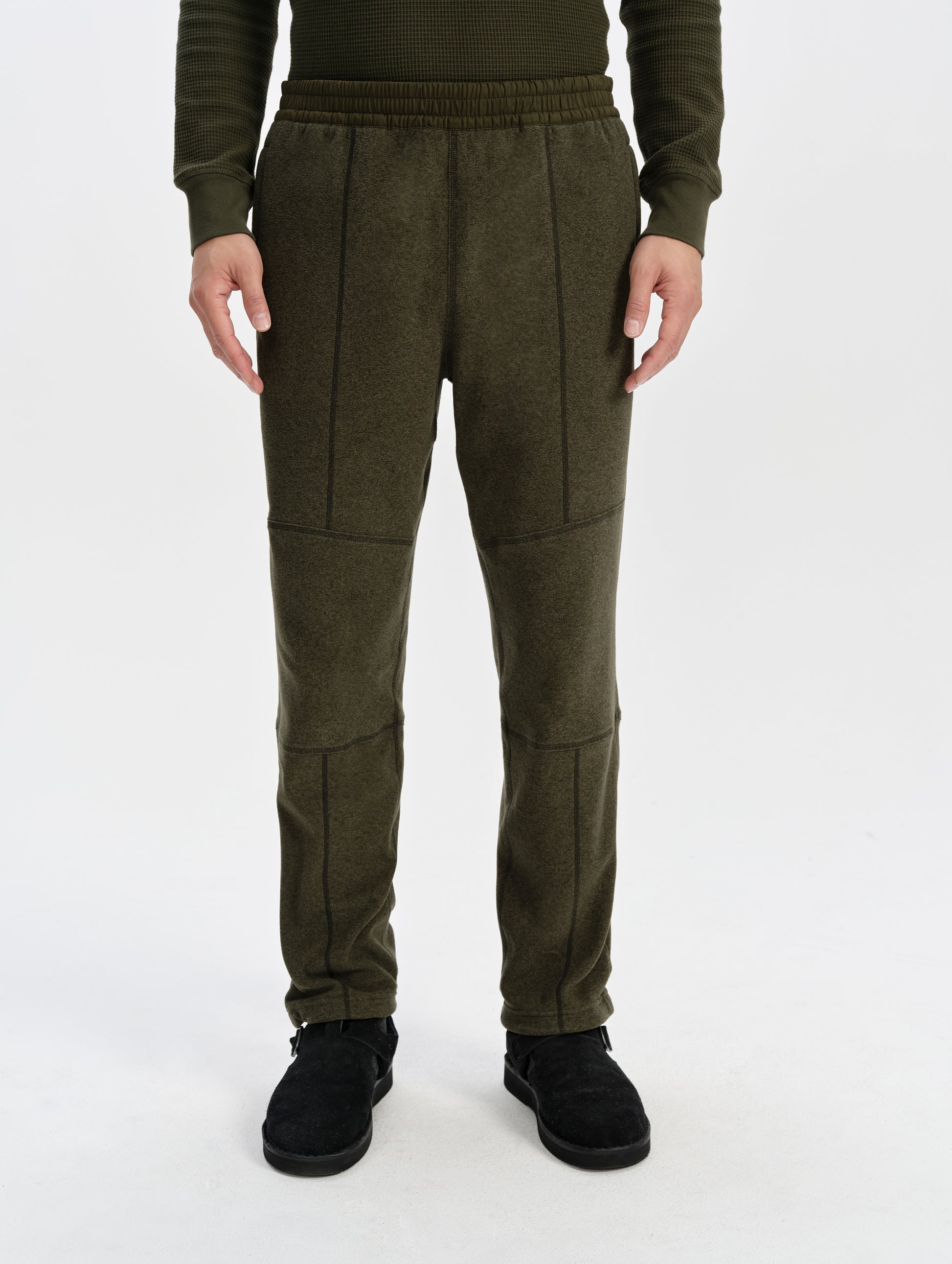 Front lower-body view of man wearing the Sutherlin Pant in Forest Green from AETHER Apparel.