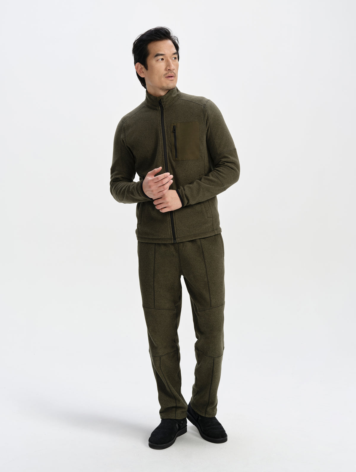 Front full-body view of man wearing the Sutherlin Pant in Forest Green from AETHER Apparel.