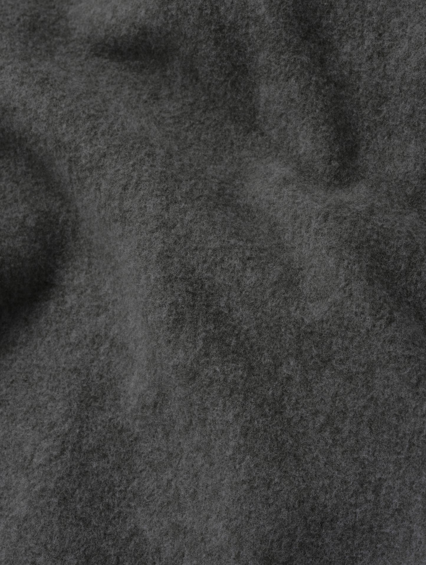 Closeup detailed view of the micro fleece construction on the Sutherlin Pant in Charcoal Grey from AETHER Apparel.
