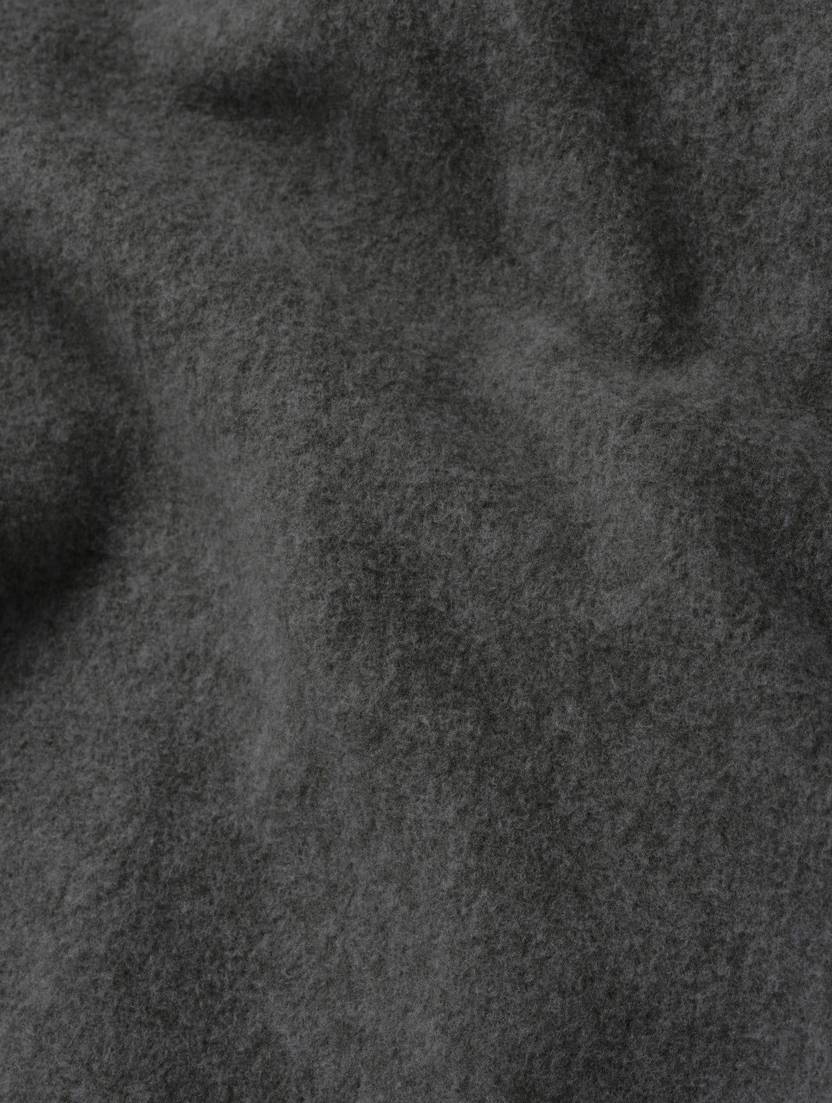 Closeup detailed view of the micro fleece construction on the Sutherlin Pant in Charcoal Grey from AETHER Apparel.