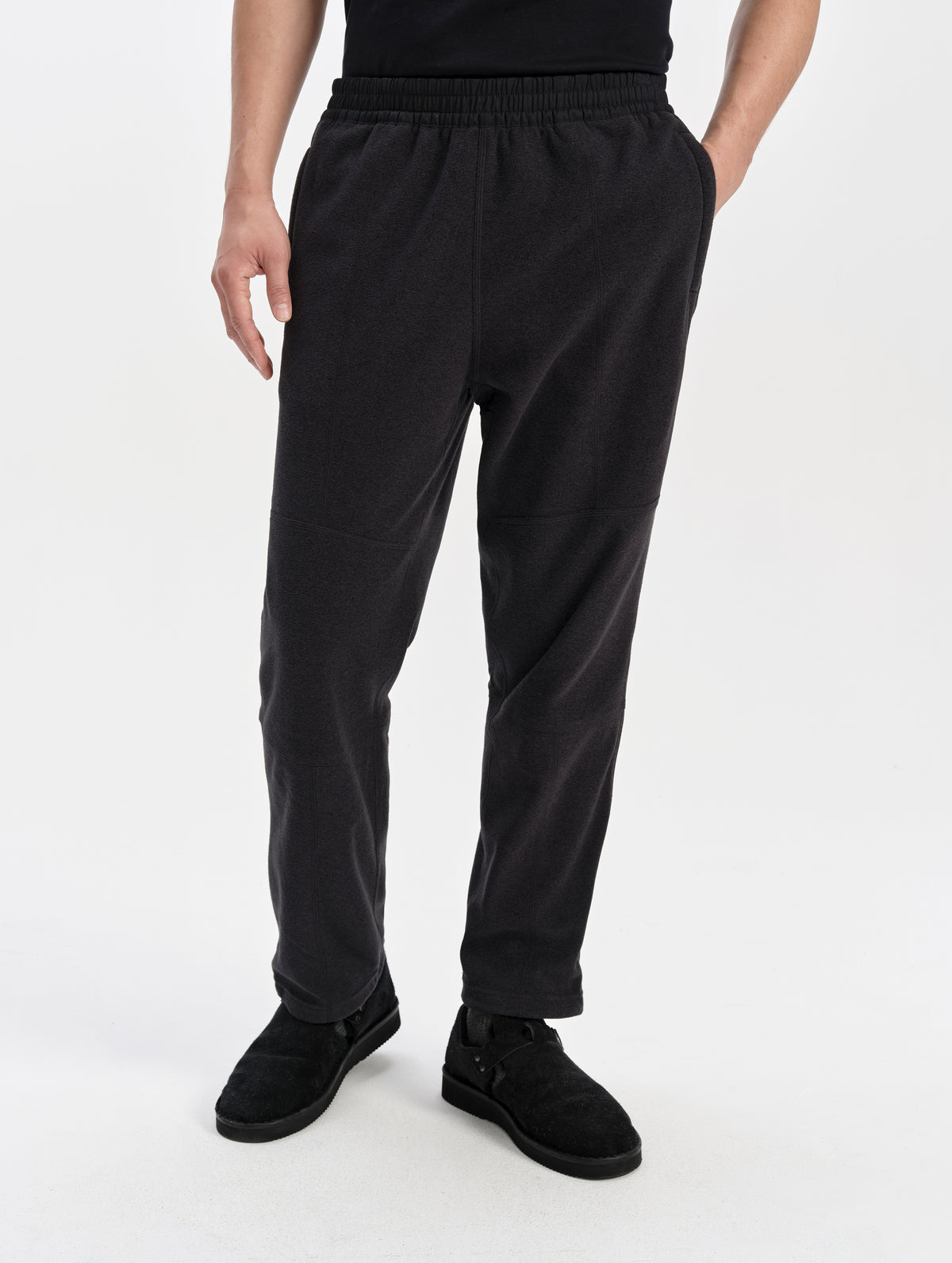 Front lower-body view of man wearing the Sutherlin Pant in Onyx Black from AETHER Apparel.