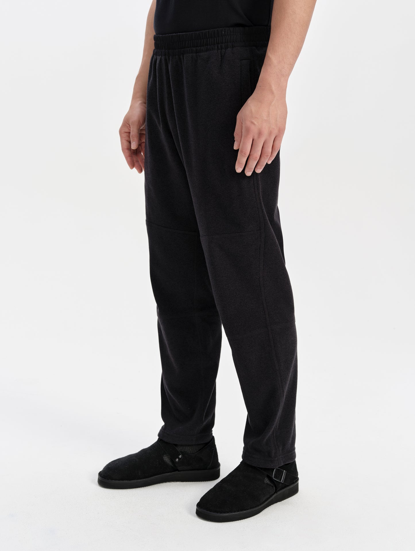 Front 3/4 lower-body view of man wearing the Sutherlin Pant in Onyx Black from AETHER Apparel.
