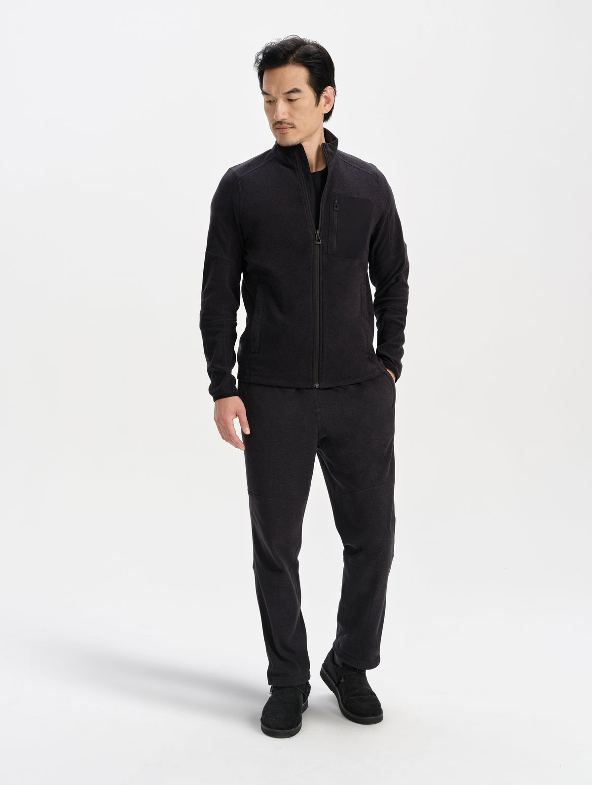 Front full-body view of man wearing the Sutherlin Pant in Onyx Black from AETHER Apparel.