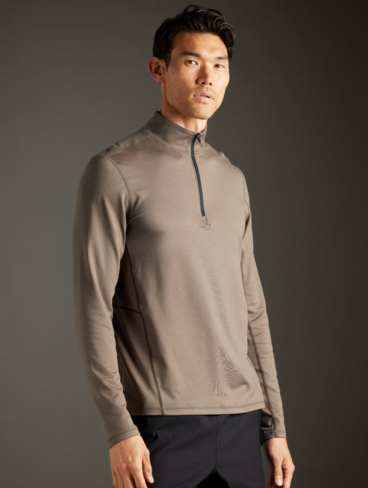 man wearing light brown half-zip from AETHER Apparel