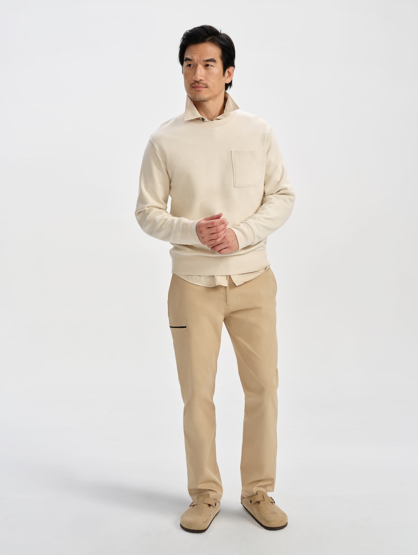 Front full-body view of man wearing the Walden Tech Pant in Desert Tan from AETHER Apparel. 