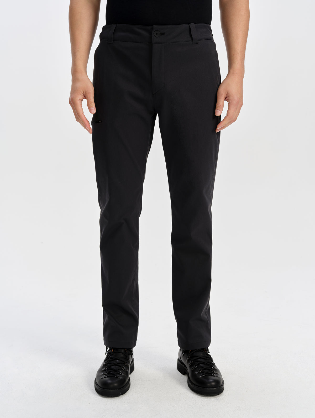 Front lower-body view of man wearing the Walden Tech Pant in Onyx Black from AETHER Apparel. 