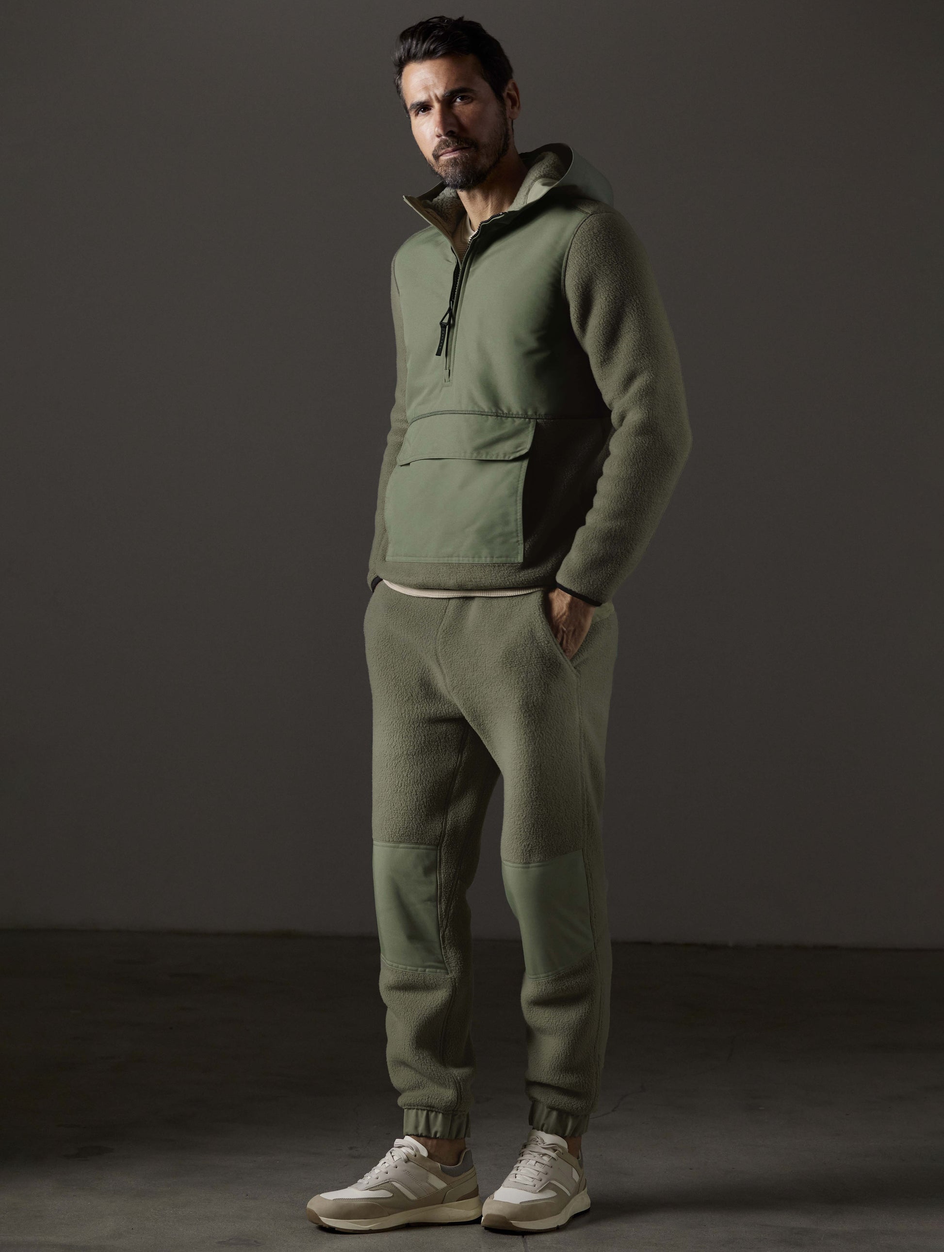 man wearing green fleece pant from AETHER Apparel