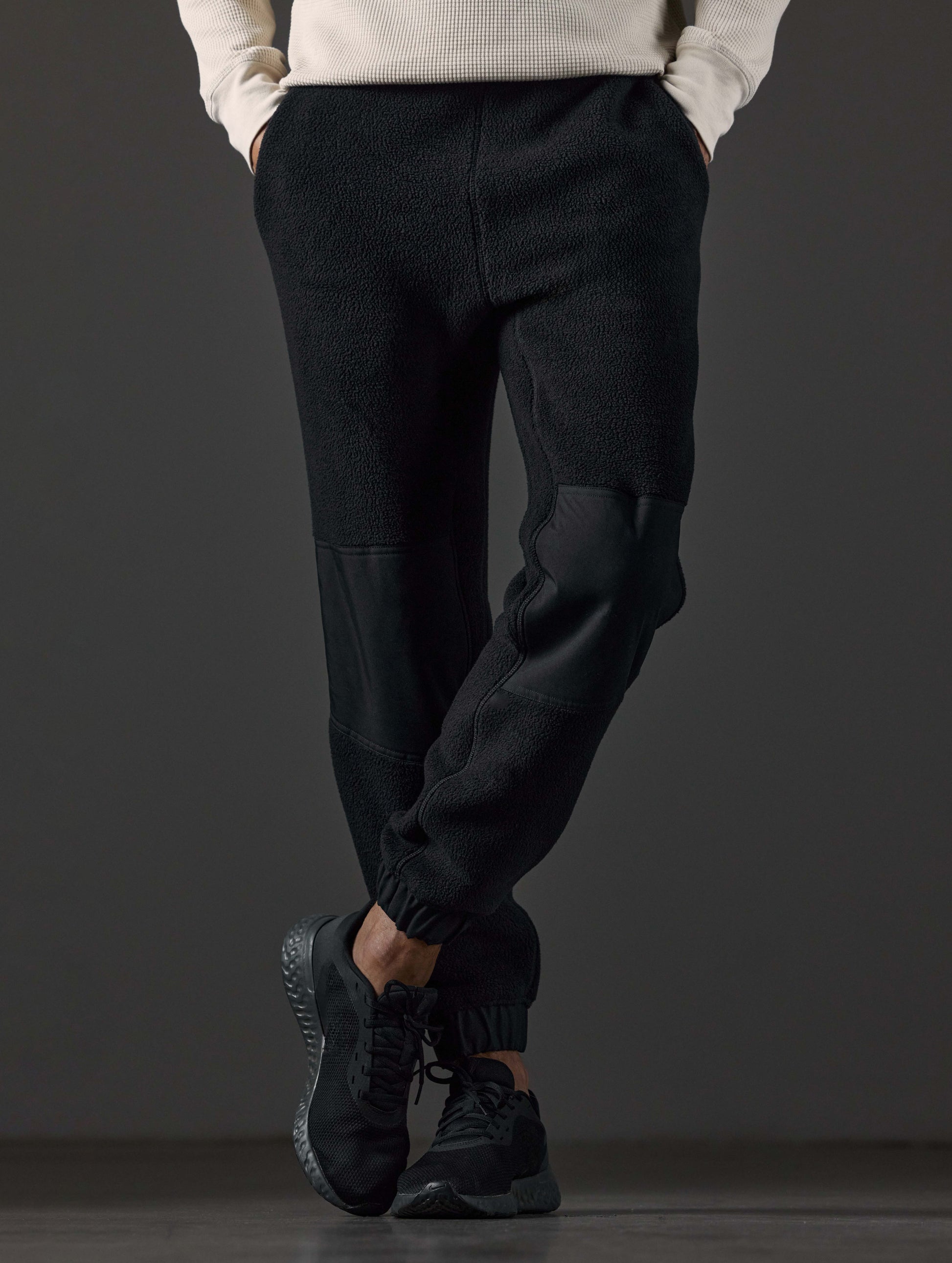 Front lower body view of man wearing Walsh Pant in Onyx Black from AETHER Apparel.