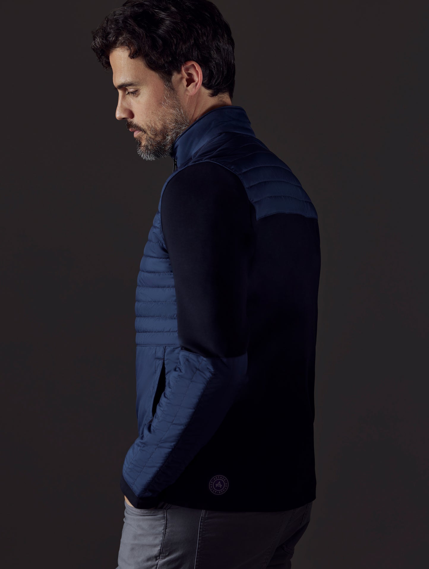 Man wearing blue technical jacket from AETHER Apparel