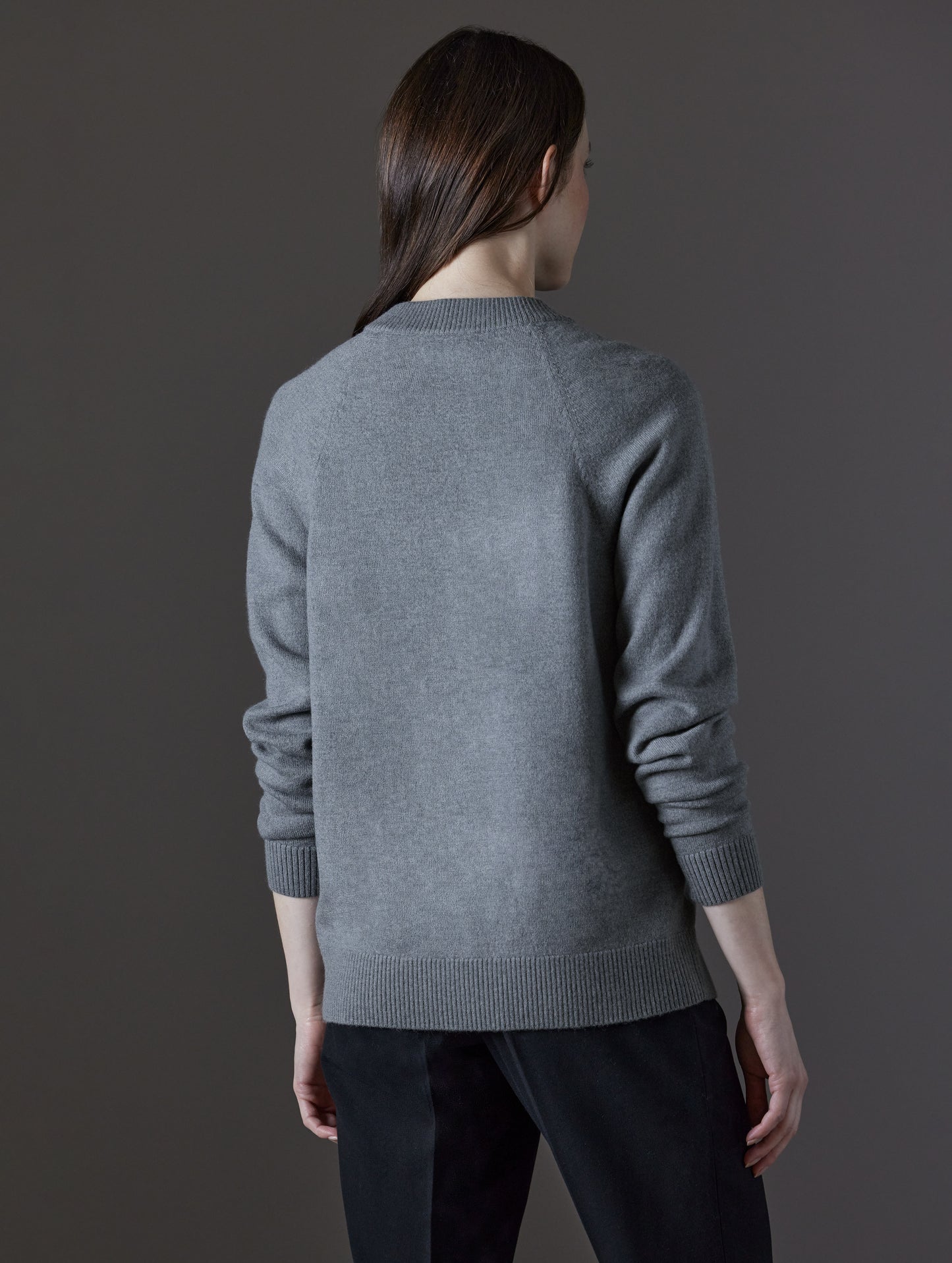 Woman wearing grey sweater from AETHER Apparel