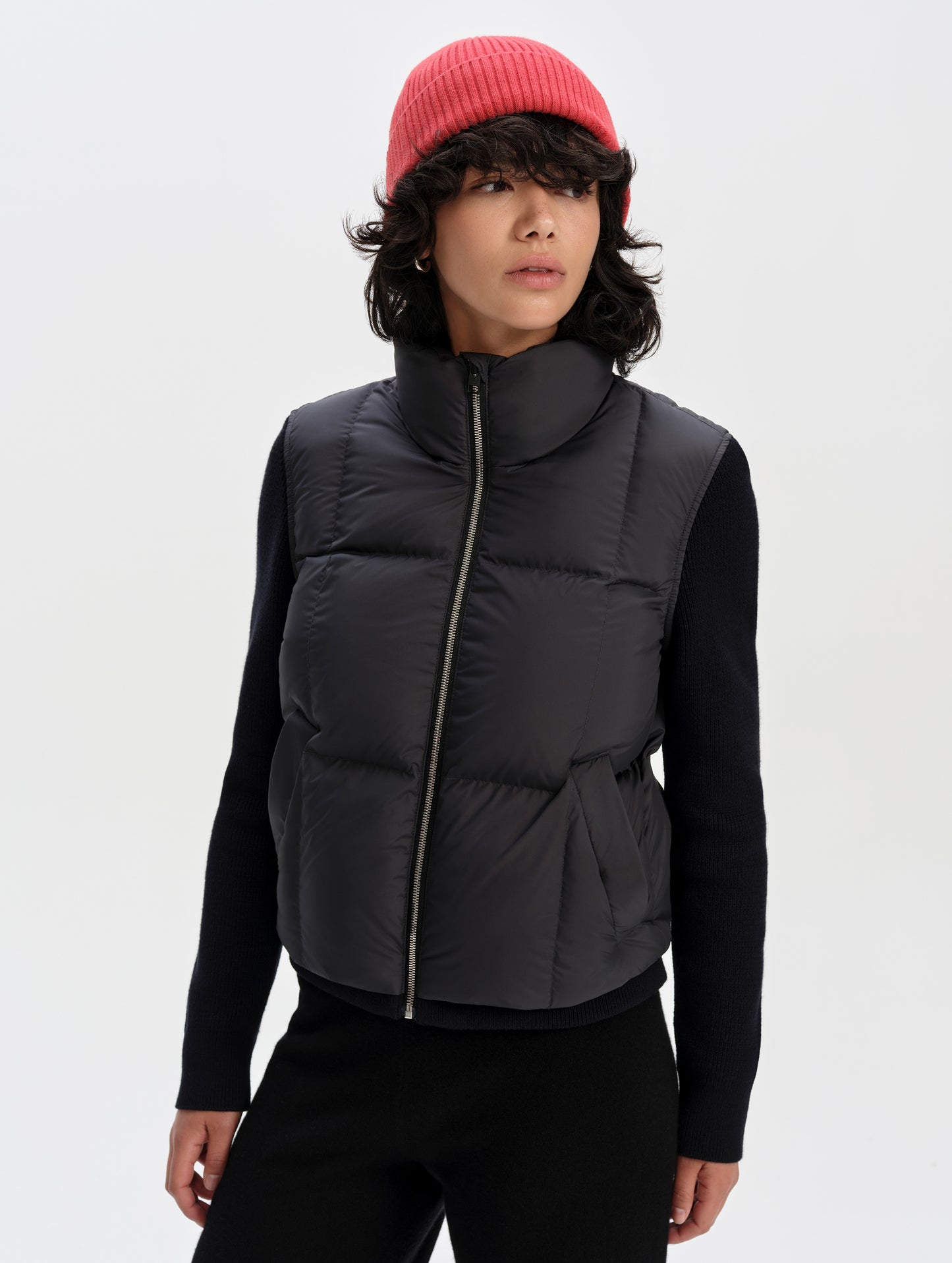 Front upper-body view of woman wearing the Nina Sweater Jacket 2.0 in Onyx Black from AETHER Apparel.