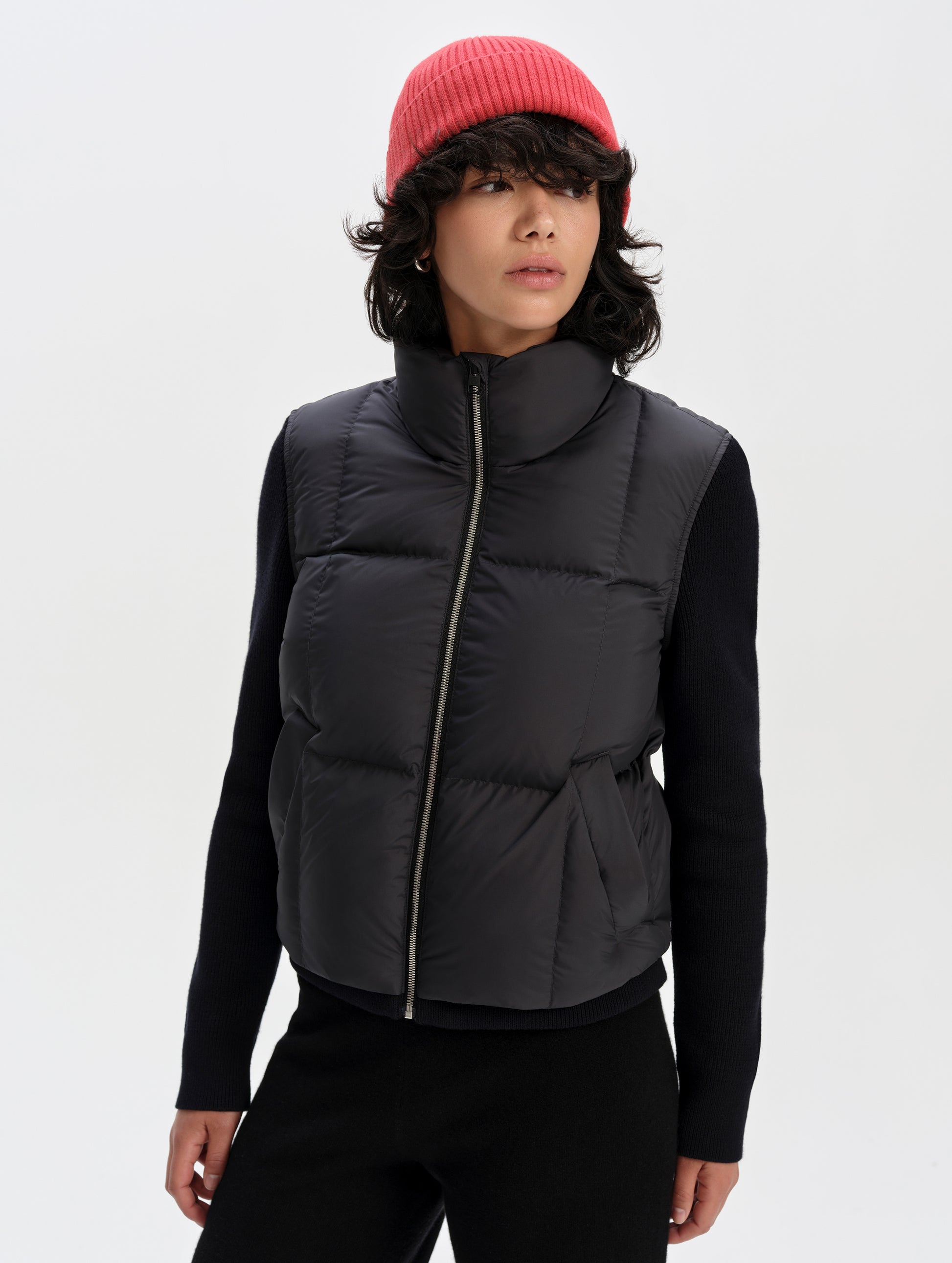 Front upper-body view of woman wearing the Nina Sweater Jacket 2.0 in Onyx Black from AETHER Apparel.