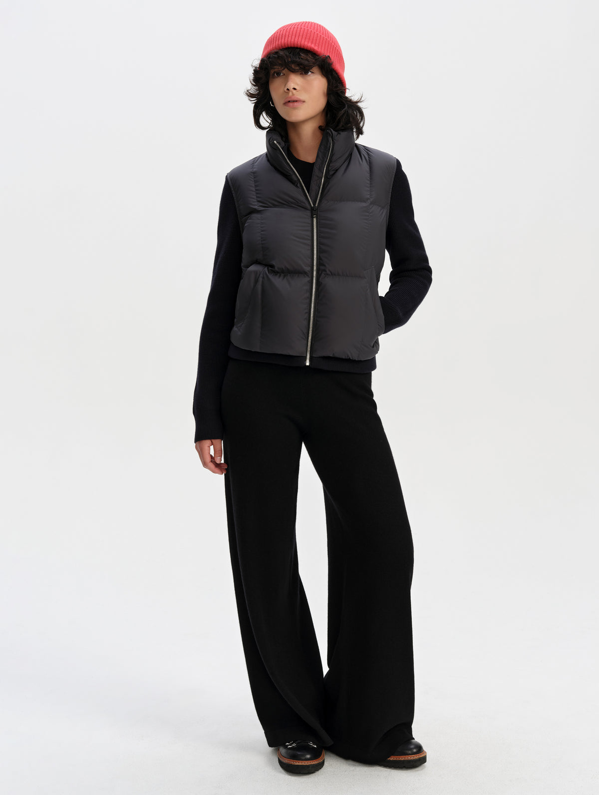 Front full-body view of woman wearing the Nina Sweater Jacket 2.0 in Onyx Black from AETHER Apparel.