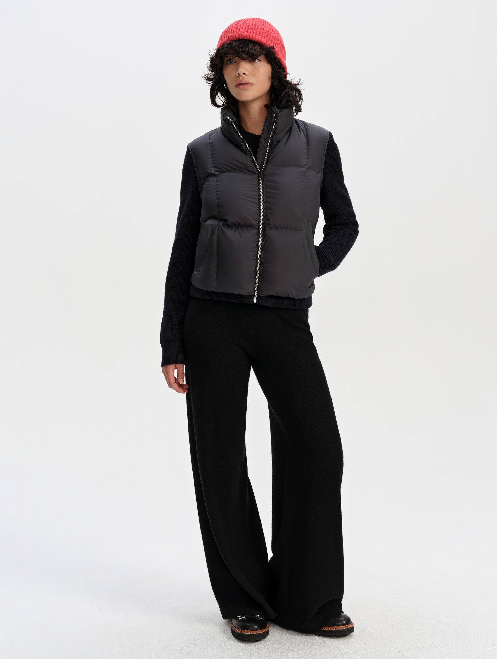 Front full-body view of woman wearing the Nina Sweater Jacket 2.0 in Onyx Black from AETHER Apparel.
