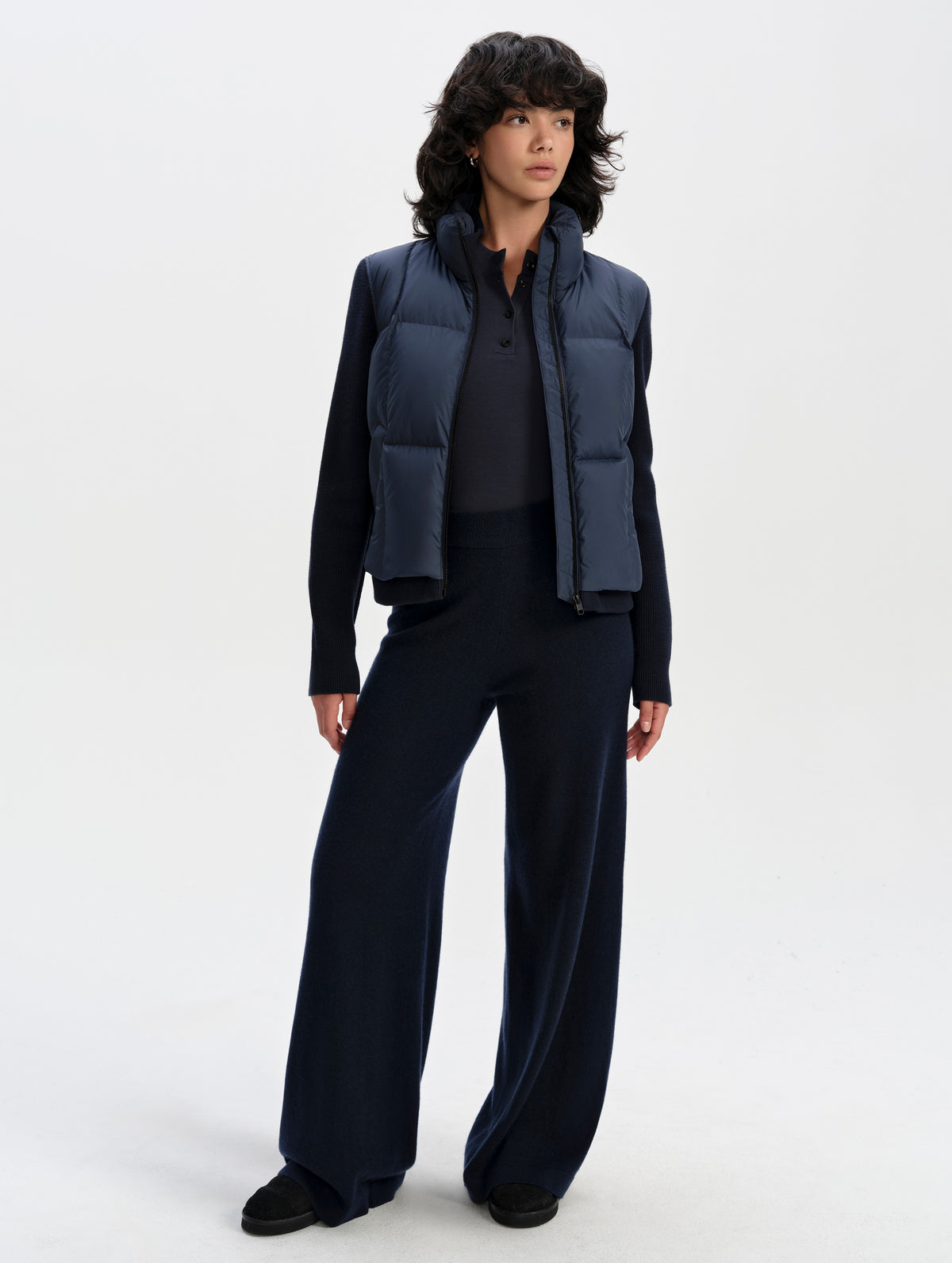 Front full-body view of woman wearing the Nina Sweater Jacket 2.0 in Total Eclipse from AETHER Apparel.