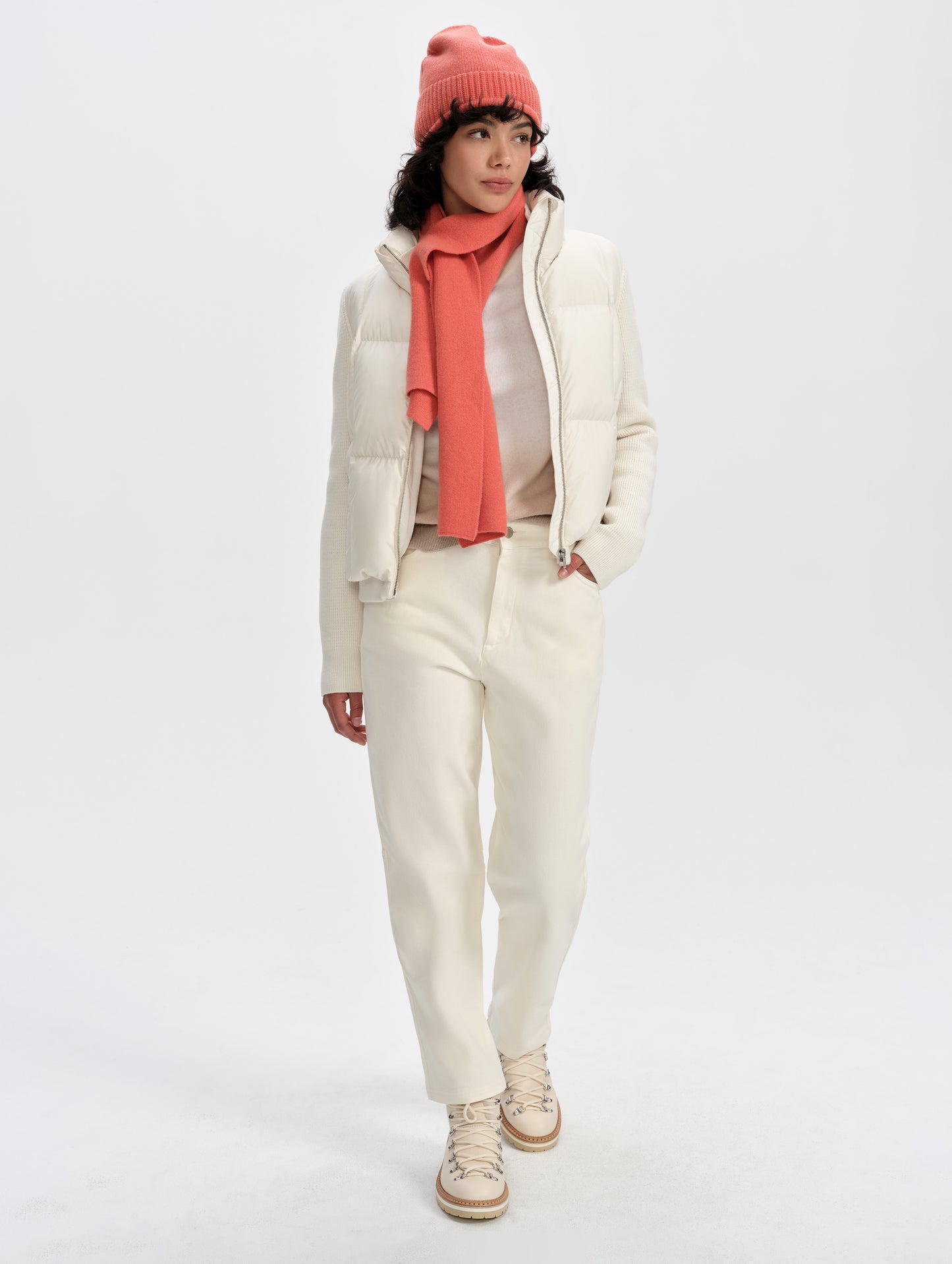 Front full-body view of woman wearing the Nina Sweater Jacket 2.0 in Winter White from AETHER Apparel.