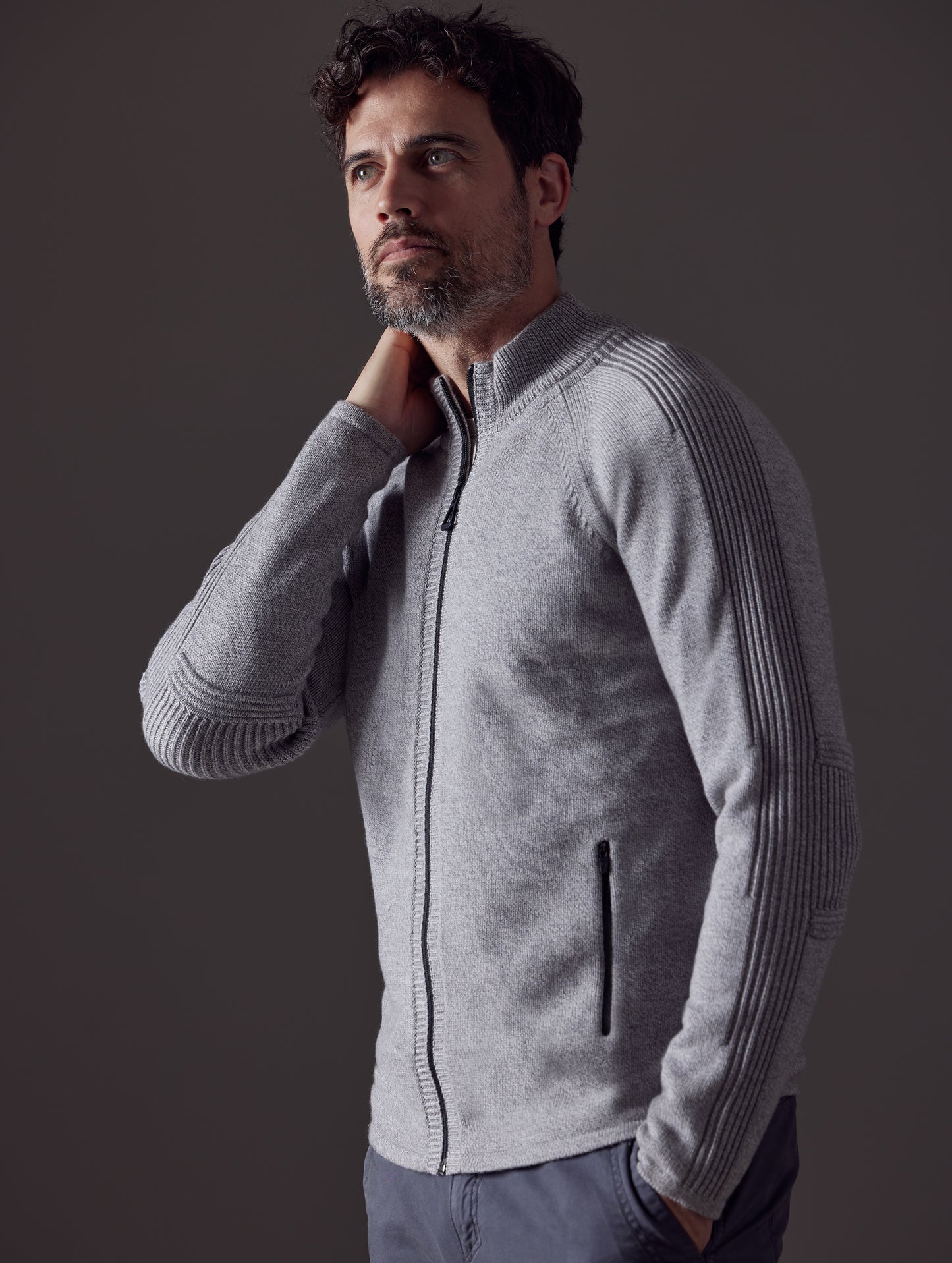 Man wearing grey Riley Full-Zip Sweater from AETHER Apparel