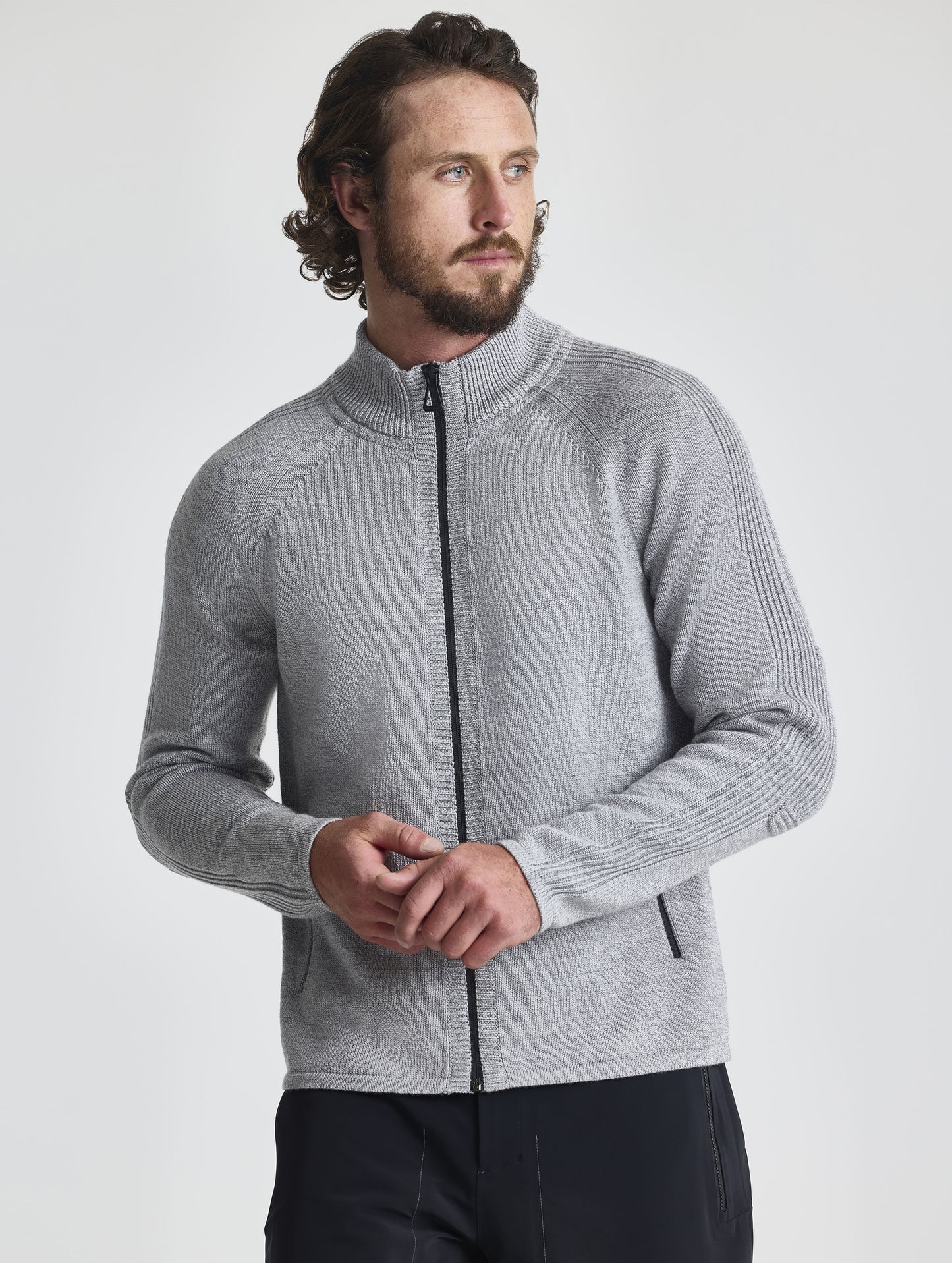 Front view of man wearing Riley Full-Zip Sweater in Light Heather Grey from AETHER Apparel.