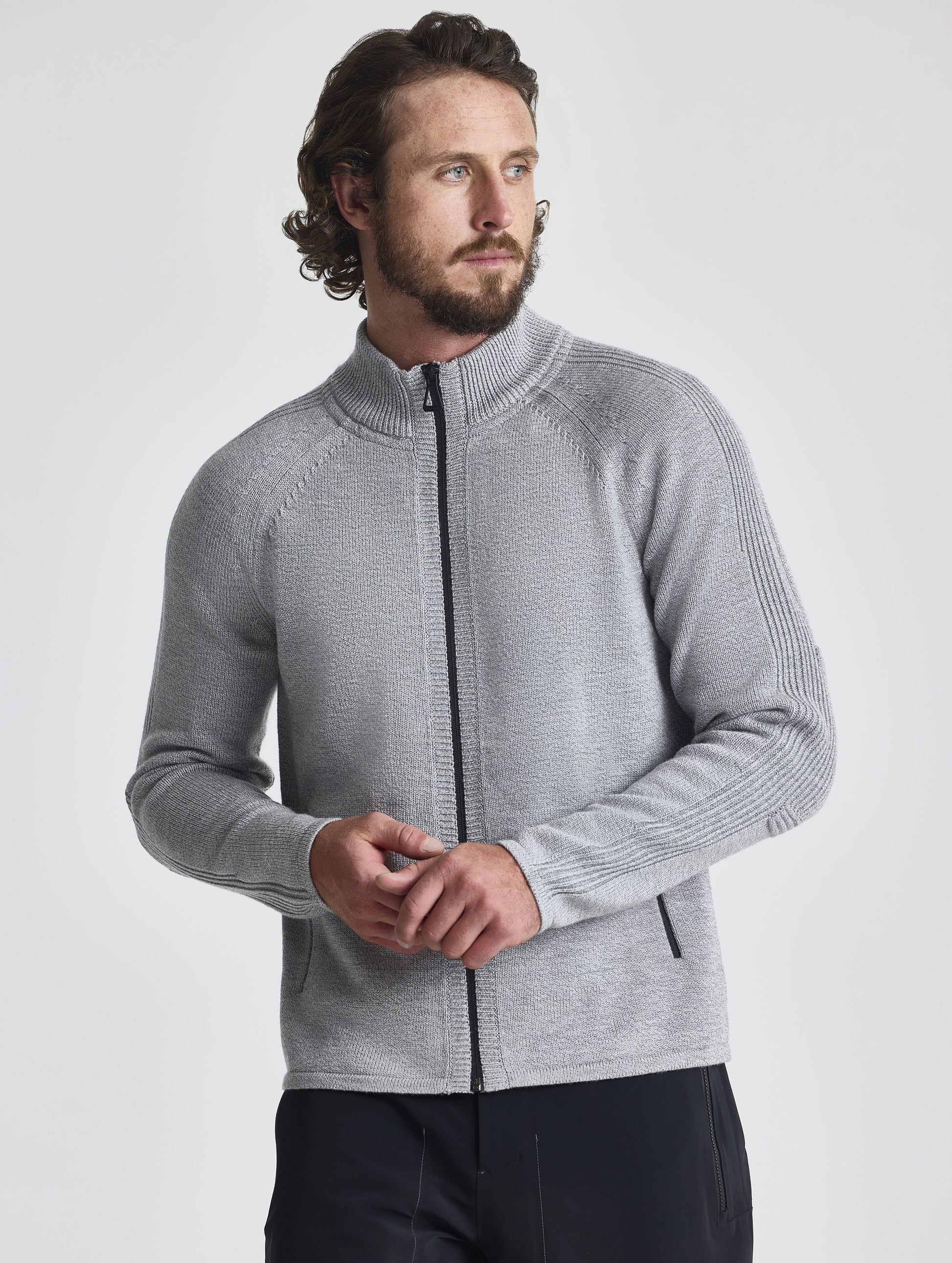 Front view of man wearing Riley Full-Zip Sweater in Light Heather Grey from AETHER Apparel.